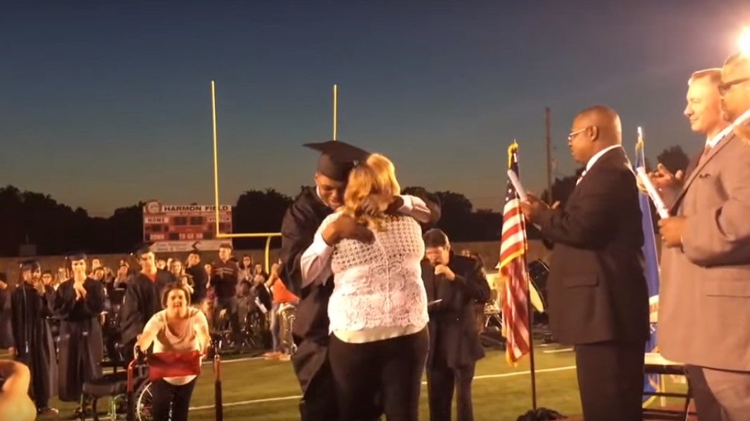 The student, pictured, rises from his wheelchair to a deafening reaction from the shocked crowd (Image credit: OkmulgeeTV via YouTube)