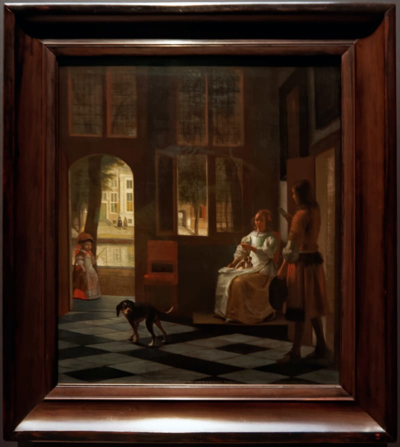 Man Handing a Letter to a Woman in the Entrance Hall of a House