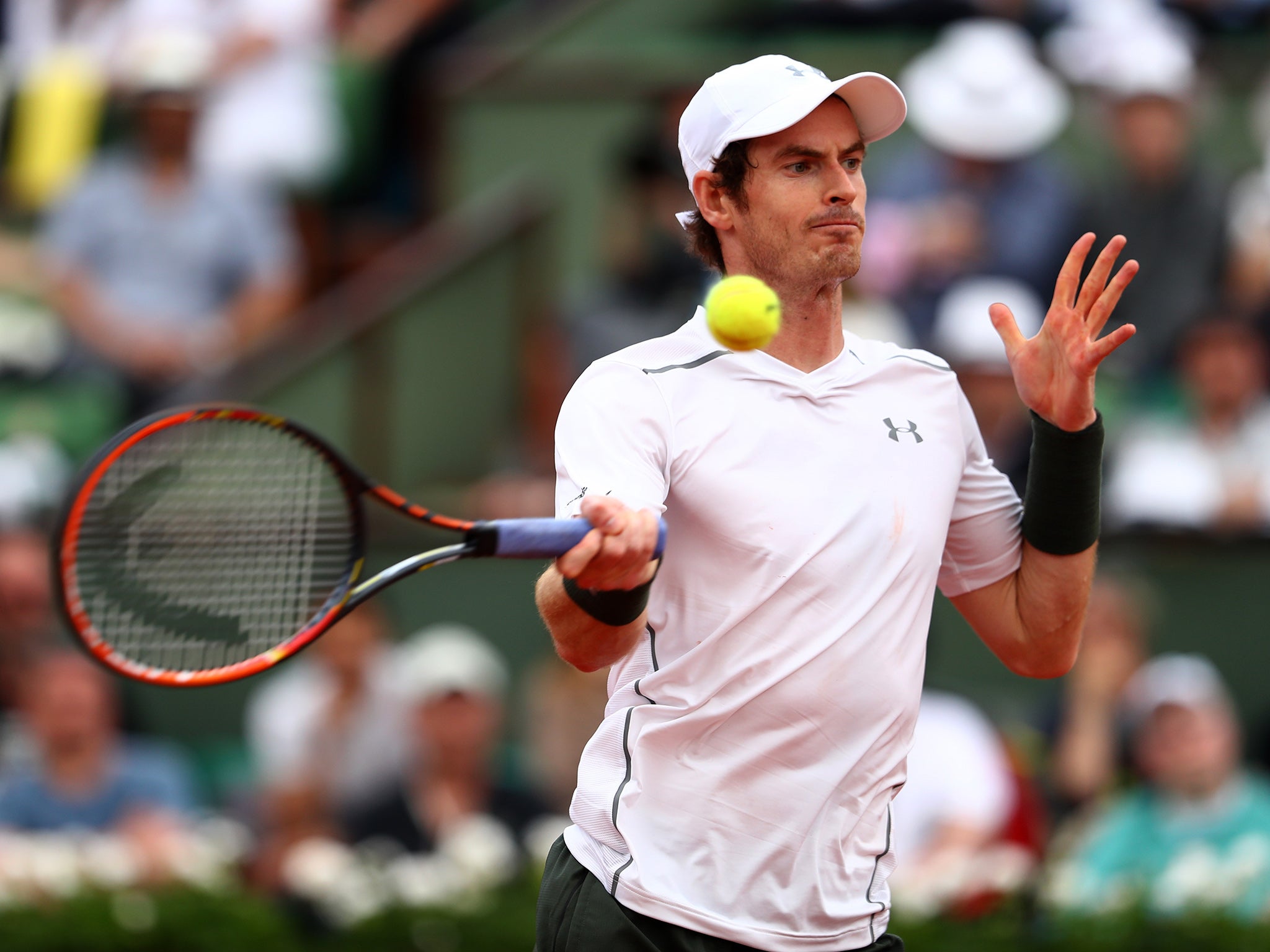 Andy Murray hits a return during his win over Mathias Bourgue