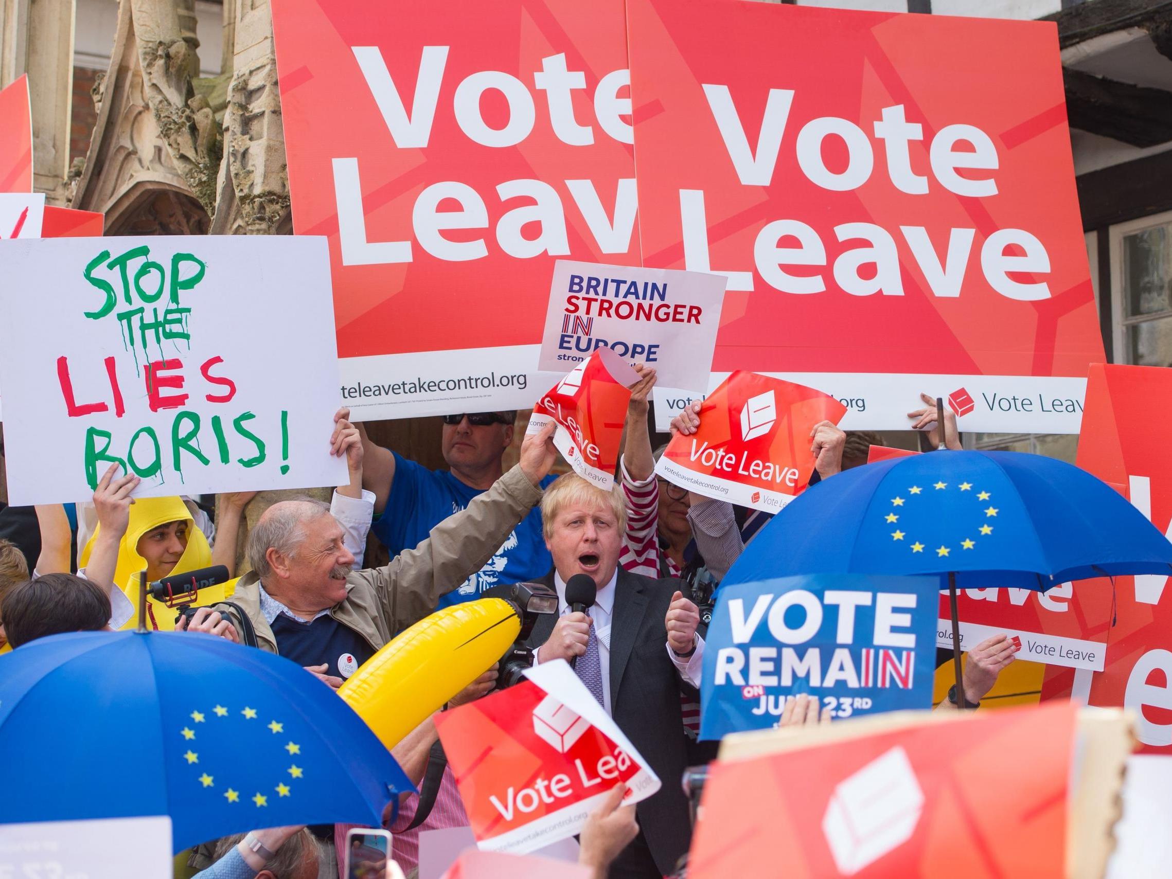 Boris Johnson is surrounded by Vote Leave and Vote Remain activists as he speaks in Winchester