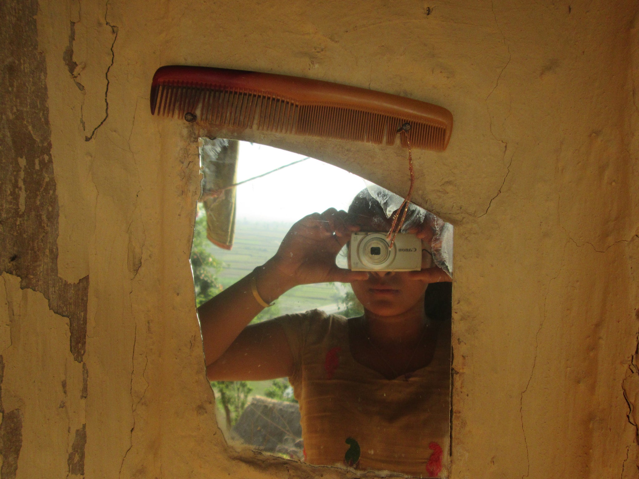 Sushma Diyali,15: "This is the picture of mirror and comb that I use at my house. In our society, when girls experience their first menstruation we are not allowed to look into mirrors or comb our hair.Me and my family do not follow such practice. I think mirrors and combs are the means of cleanliness and as a human it’s very important that you should stay clean and healthy. Only if my friends just like me could grow in an environment where are no limitations regarding menstruation and receive more support from the families, they can set themselves free and explore greater potential and opportunities around them is what I think."