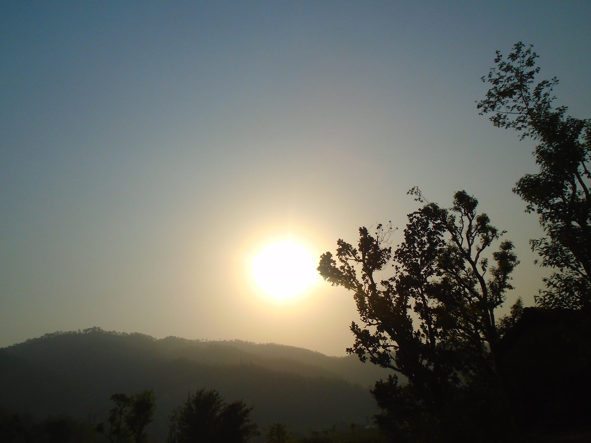 Bandana Khadka,15: "This is the scene I wake up to every morning when I face towards the eastern side. This picture reflects the hills and peaks along with the beautiful sunrise that is visible from my home. It feels really good to get soaked in the morning sun. When I had my first menstruation, I was not allowed to look into the sun directly. But regardless of that I still looked at it and nothing happened to me. While studying our teacher taught us that there is something called sunshine vitamin which is vitamin-D and we get that from sun rays. After I got to know that, I realized we shouldn’t be kept locked inside our rooms during our first menstruation."