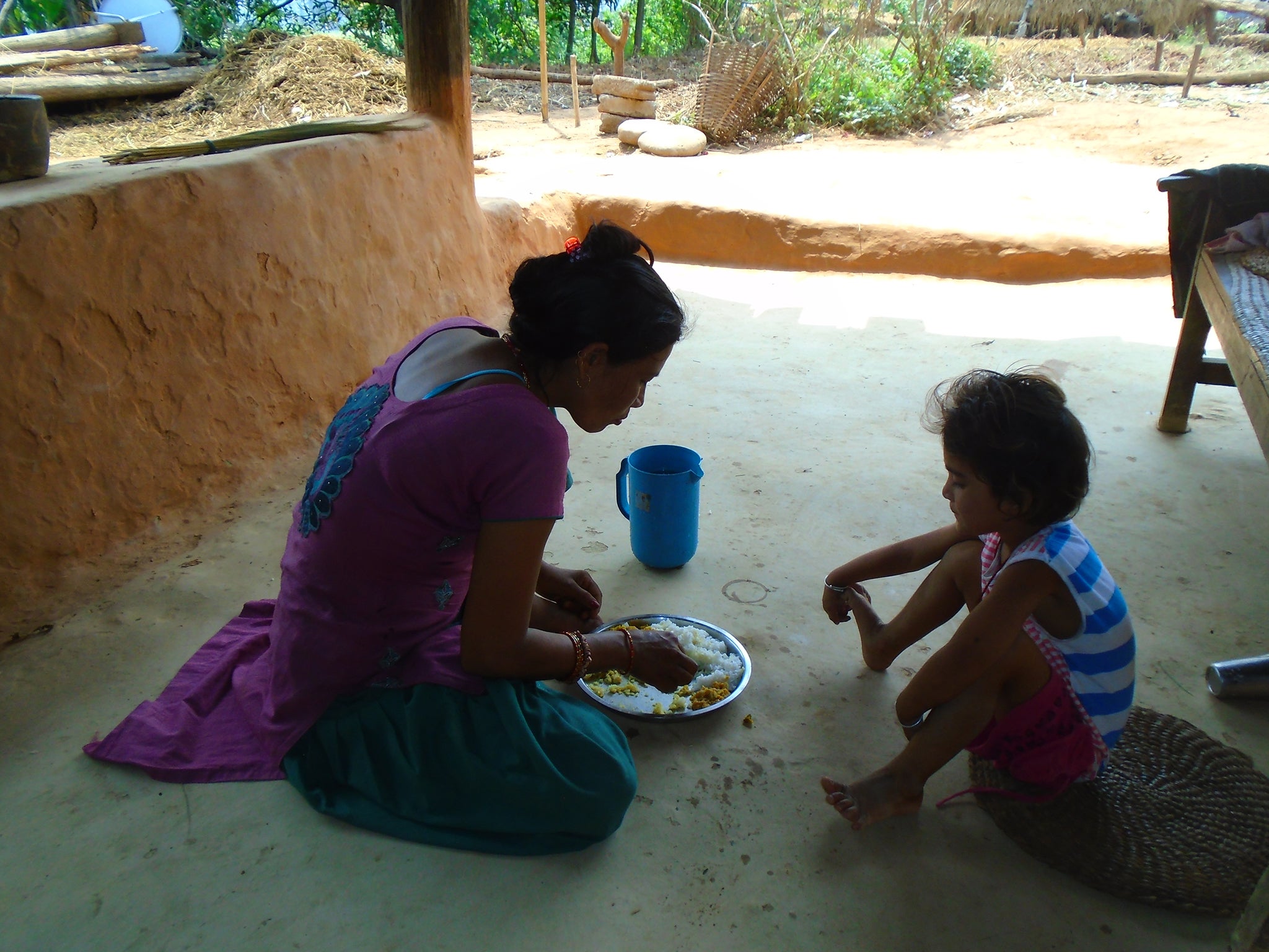 Bandana Khadka, 15: "This is my mother and sister in the picture. Here, my mother is feeding my sister with so much of love. Mother loves me very much as well. However, during my menstruation cycle I am kept separately and have to eat at distance. When nobody touches me, I feel unloved. We need lots of love and support during our menstruation but, when I am separated and treated like an untouchable I feel no love from my mother and father and I feel only hatred. I feel sad being treated that way."