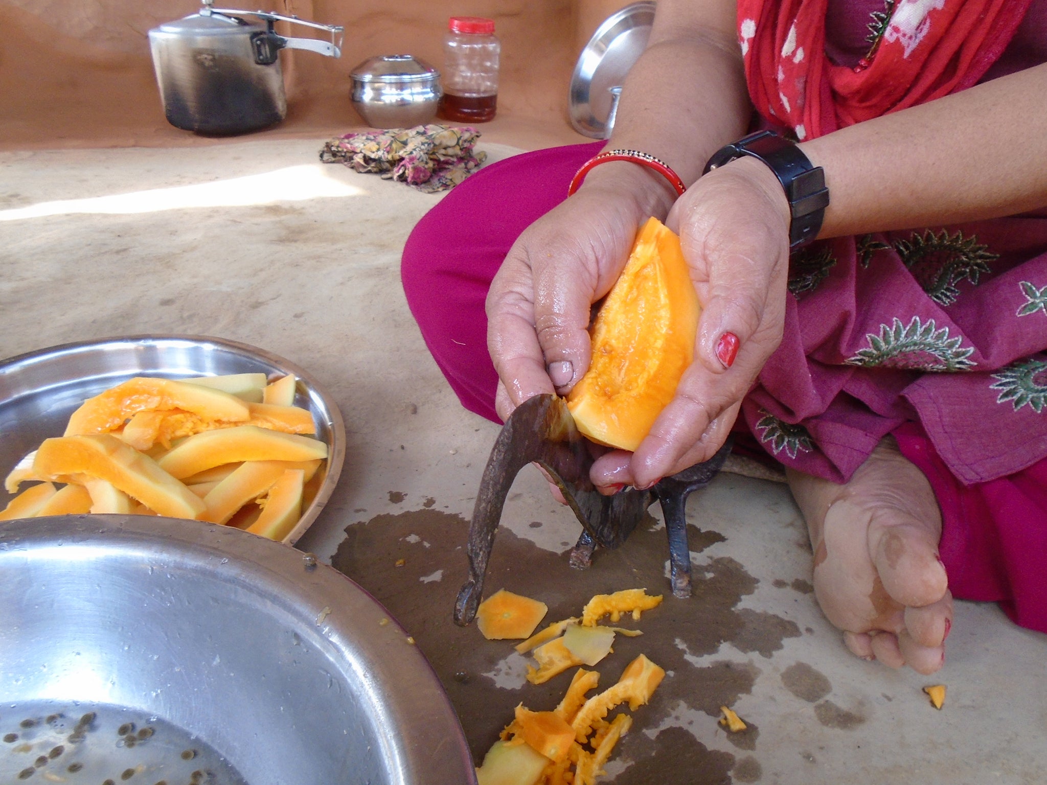 Sabina Gautam,15: In this photo my mom is cutting papaya. In our community, there is a belief that during menstruation we should not eat papaya but I like papaya very much. Even if I want I cannot eat papaya during my periods. Papaya is a nutritious fruit. During menstruation, we are told not only not to eat papaya but also we are told not to touch papaya tree is a common belief. Actually during menstruation, the adolescent girls should eat even more fruits and vegetable to keep the body strong and healthy