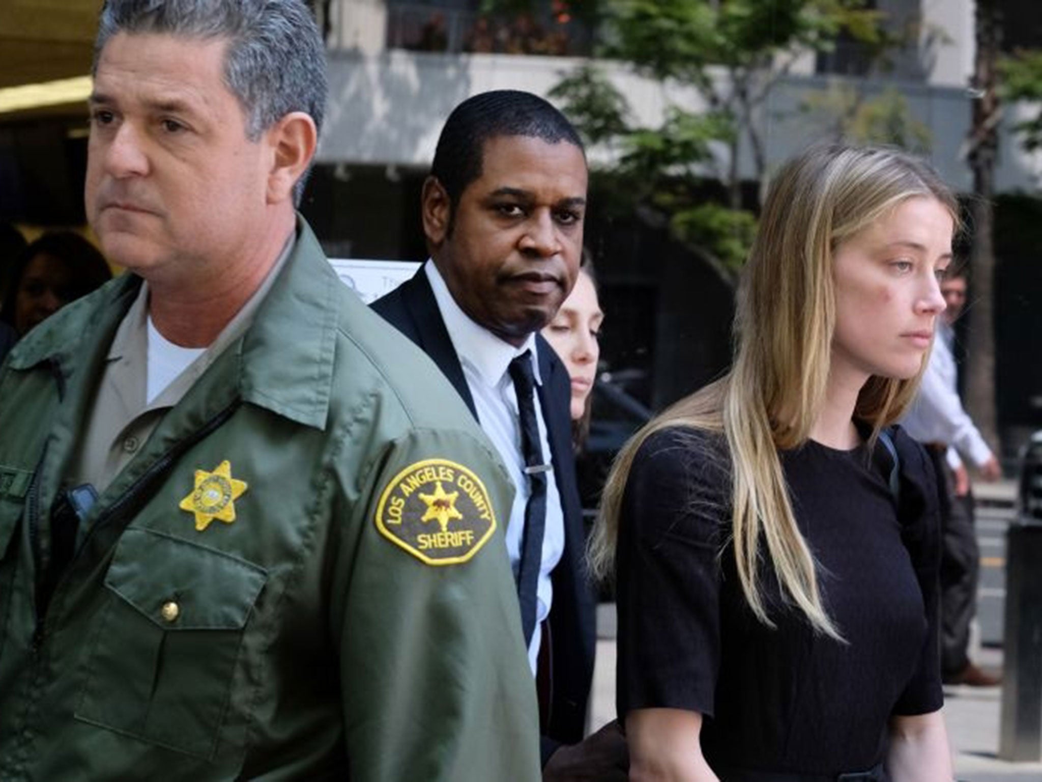 Amber Heard leaves Los Angeles Superior Court court on Friday, 27 May, 2016, after giving a sworn declaration that her husband Johnny Depp threw her phone at her during a fight Saturday, striking her cheek and eye