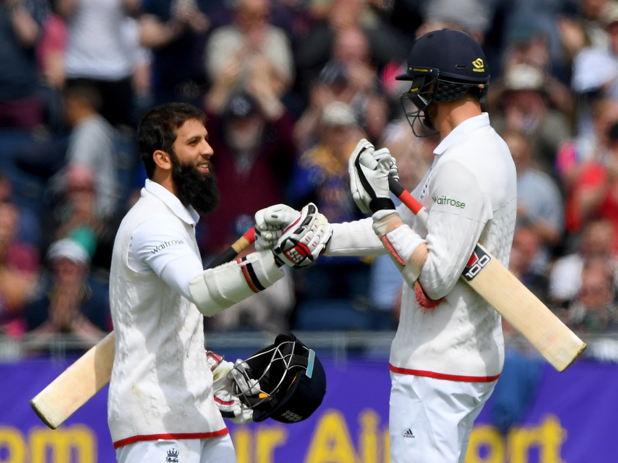 Moeen celebrates his century with team-mate Steven Finn