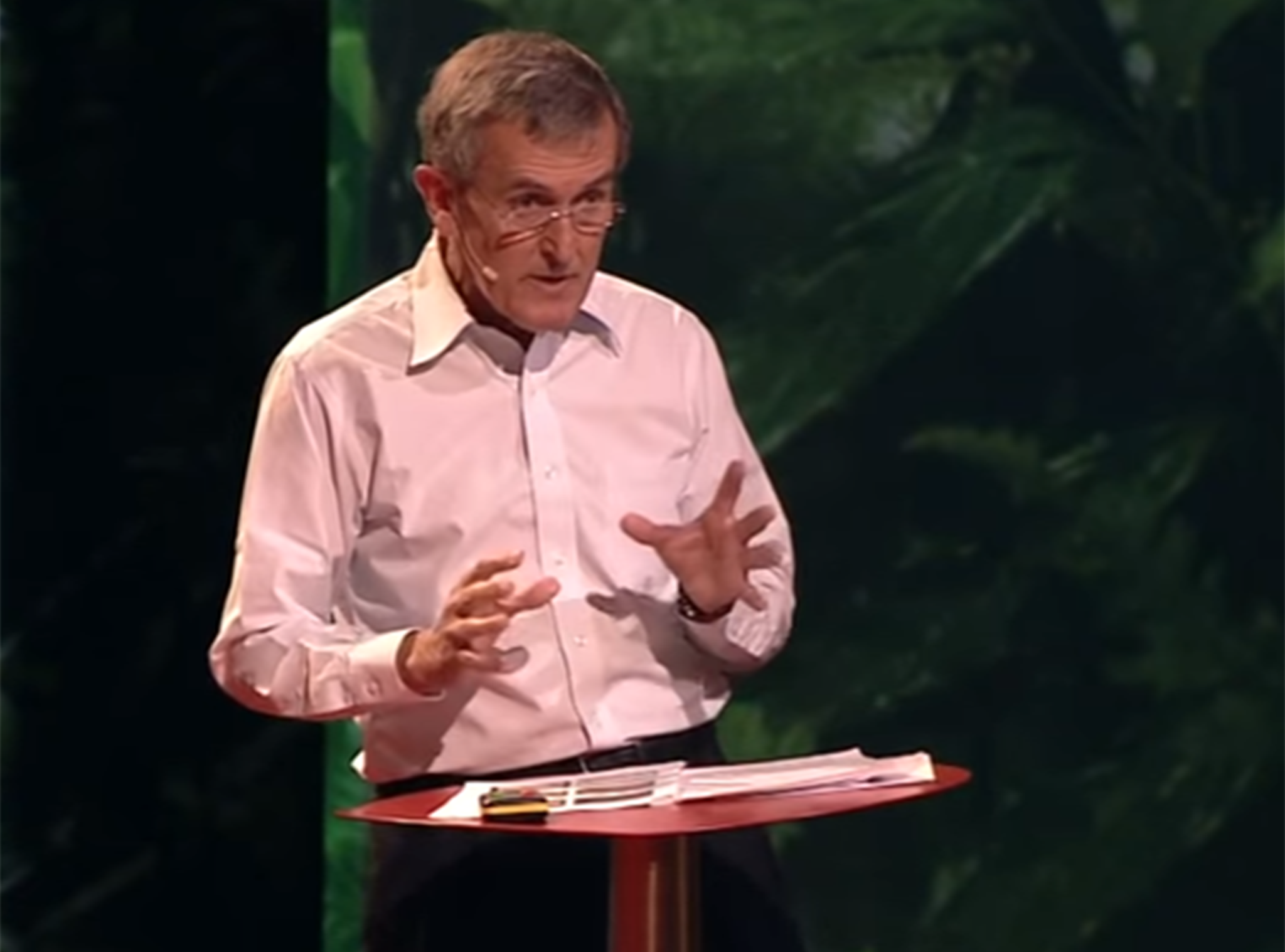 Neil MacGregor speaking at a TED talk in 2012