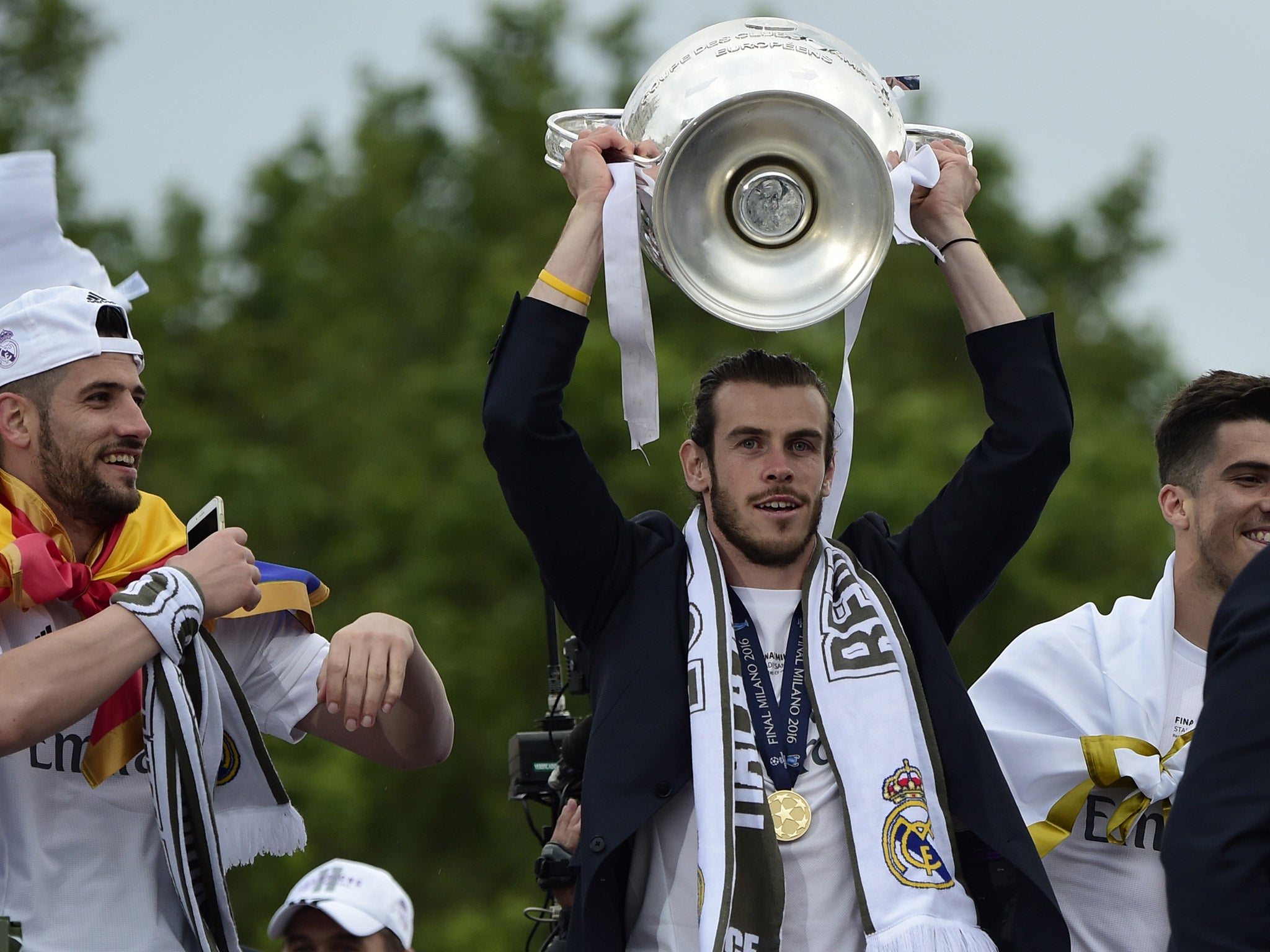 Gareth Bale celebrates with the Champions League trophy