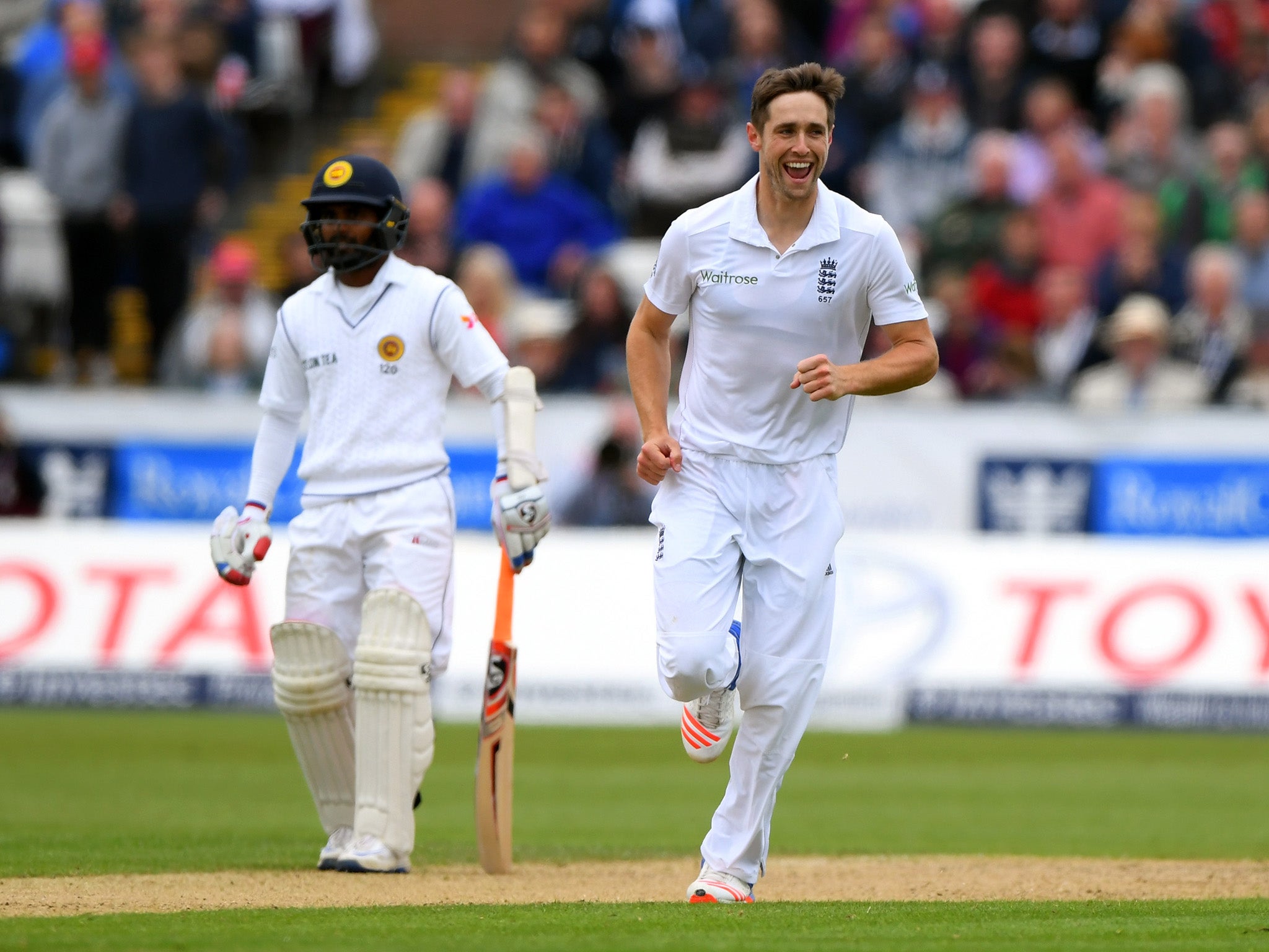 Chris Woakes celebrates one of four wickets so far