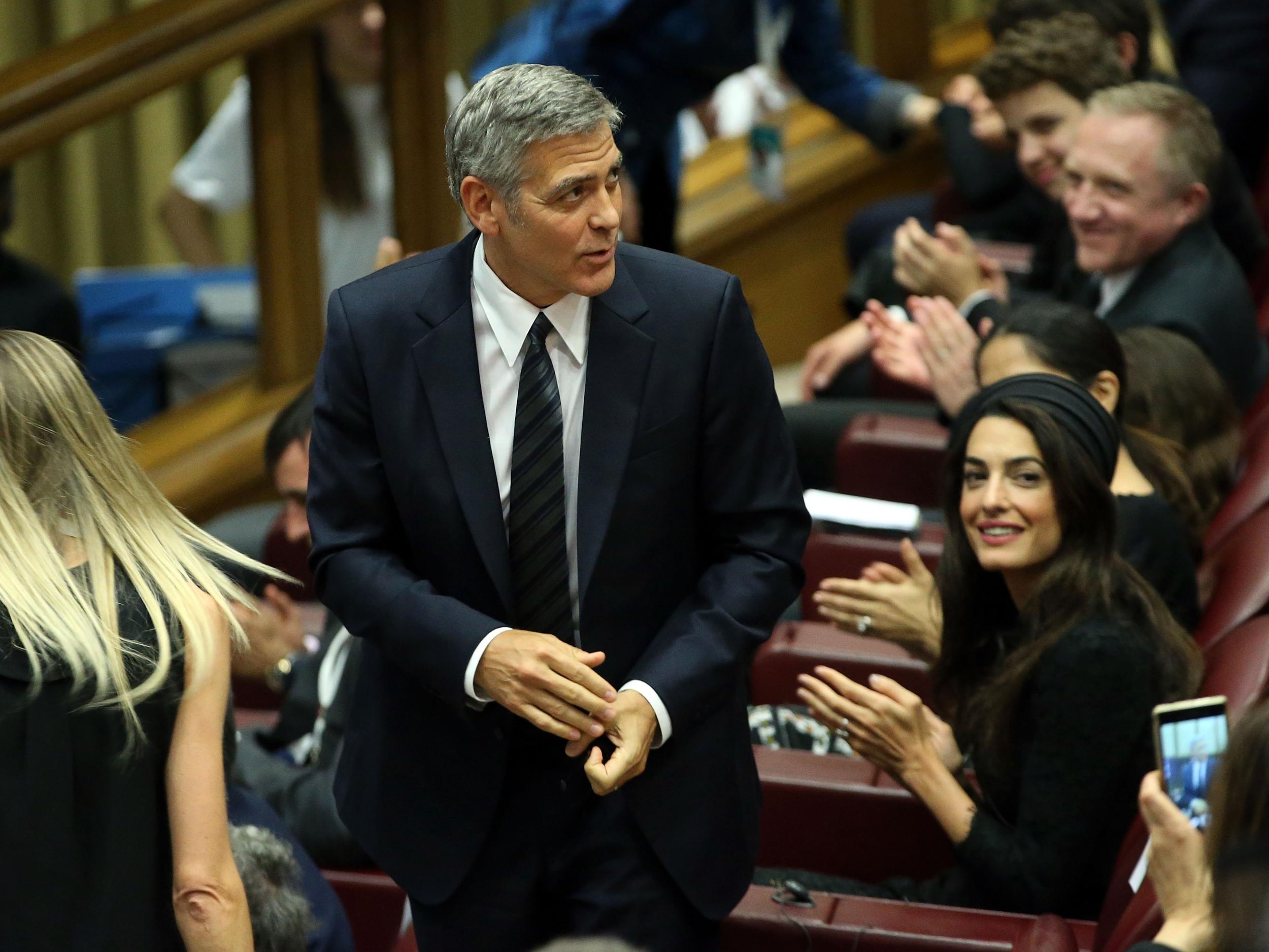 George Clooney and Amal Clooney attend 'Un Muro o Un Ponte' Seminary held by Pope Francis at the Paul VI Hall on May 29, 2016 in Vatican City (Getty Images )