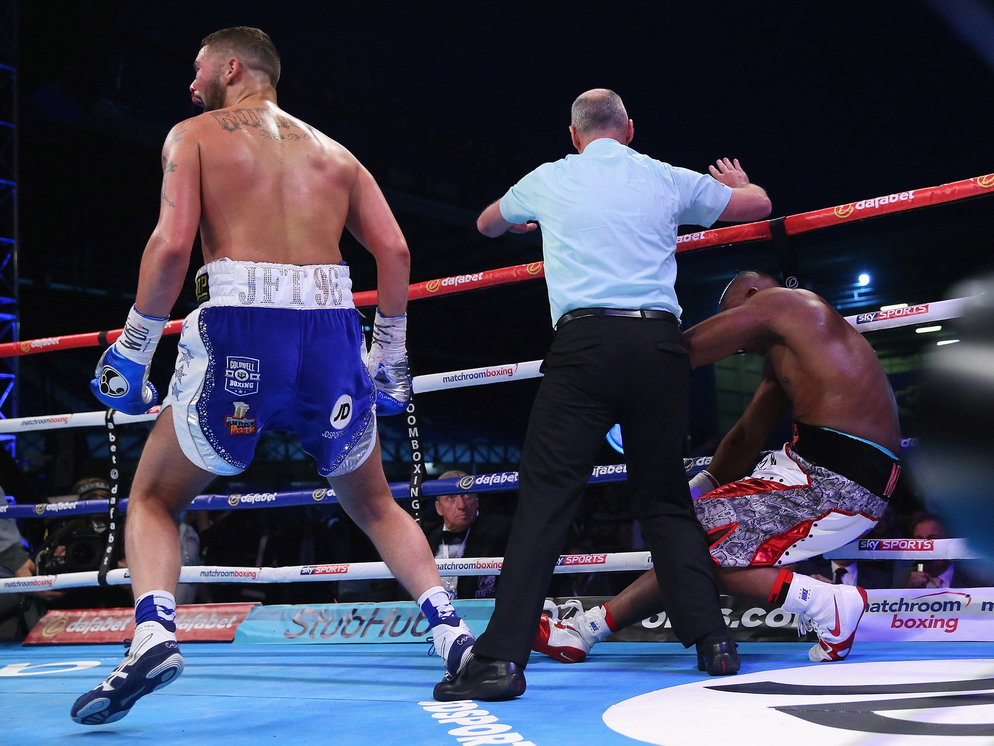 Makabu collapses to the canvas after being knocked out by Bellew