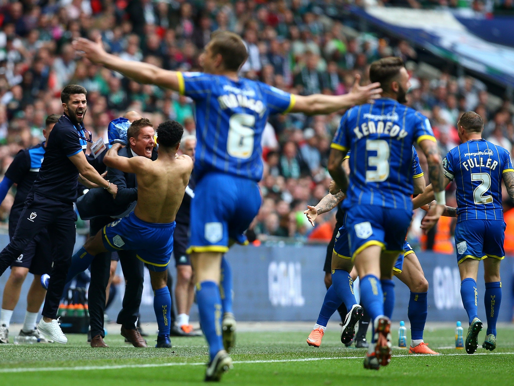 Wimbledon celebrate their play-off success at Wembley