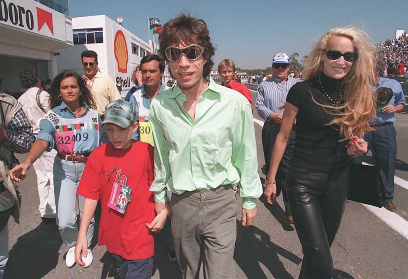 Mick Jagger(C) of the Rolling stones with his ex-wife Jerry Hall(R) and his son(L)