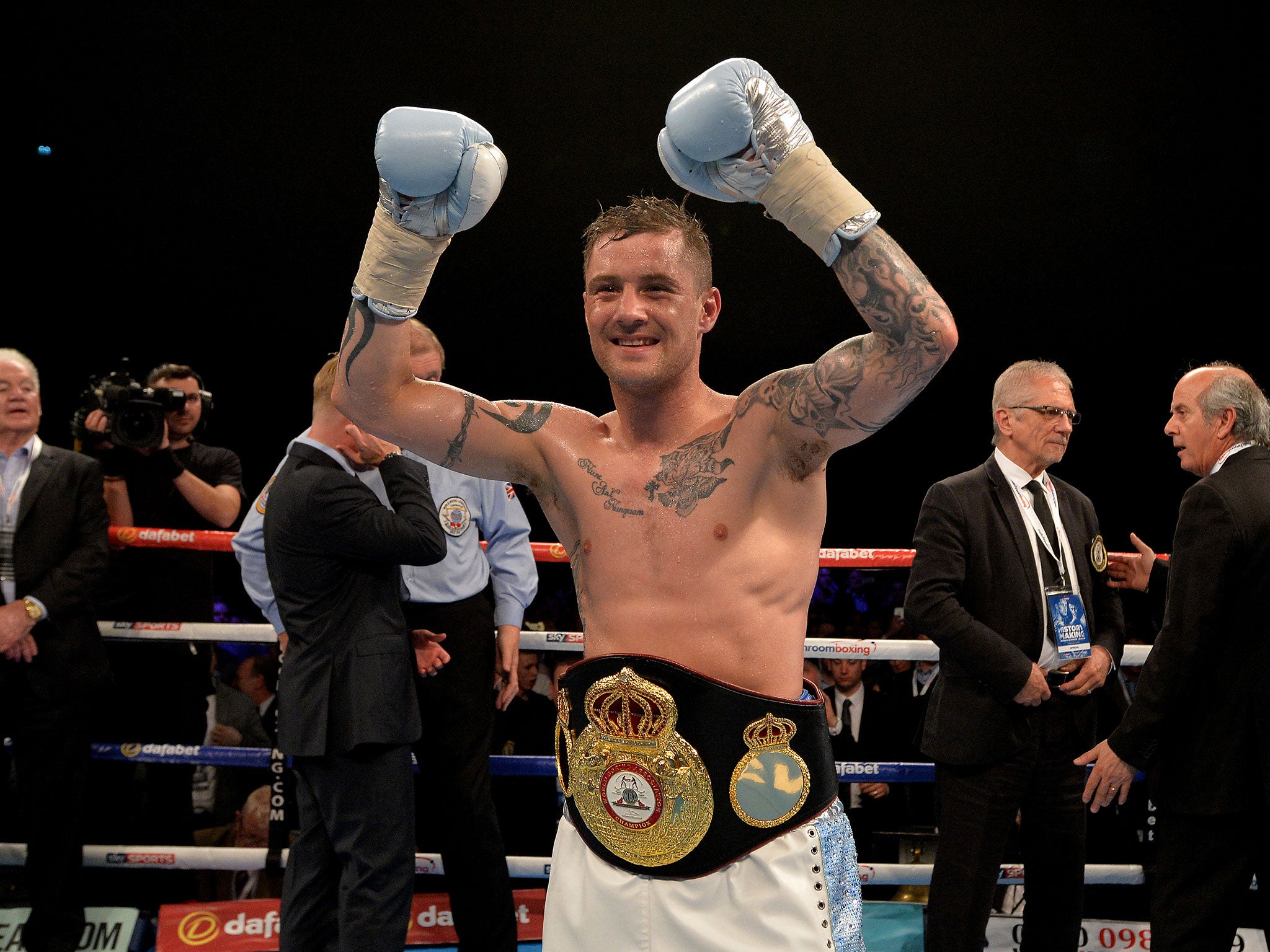 Ricky Burns celebrates beating Michele Di Rocco to win the WBA world super-lightweight title