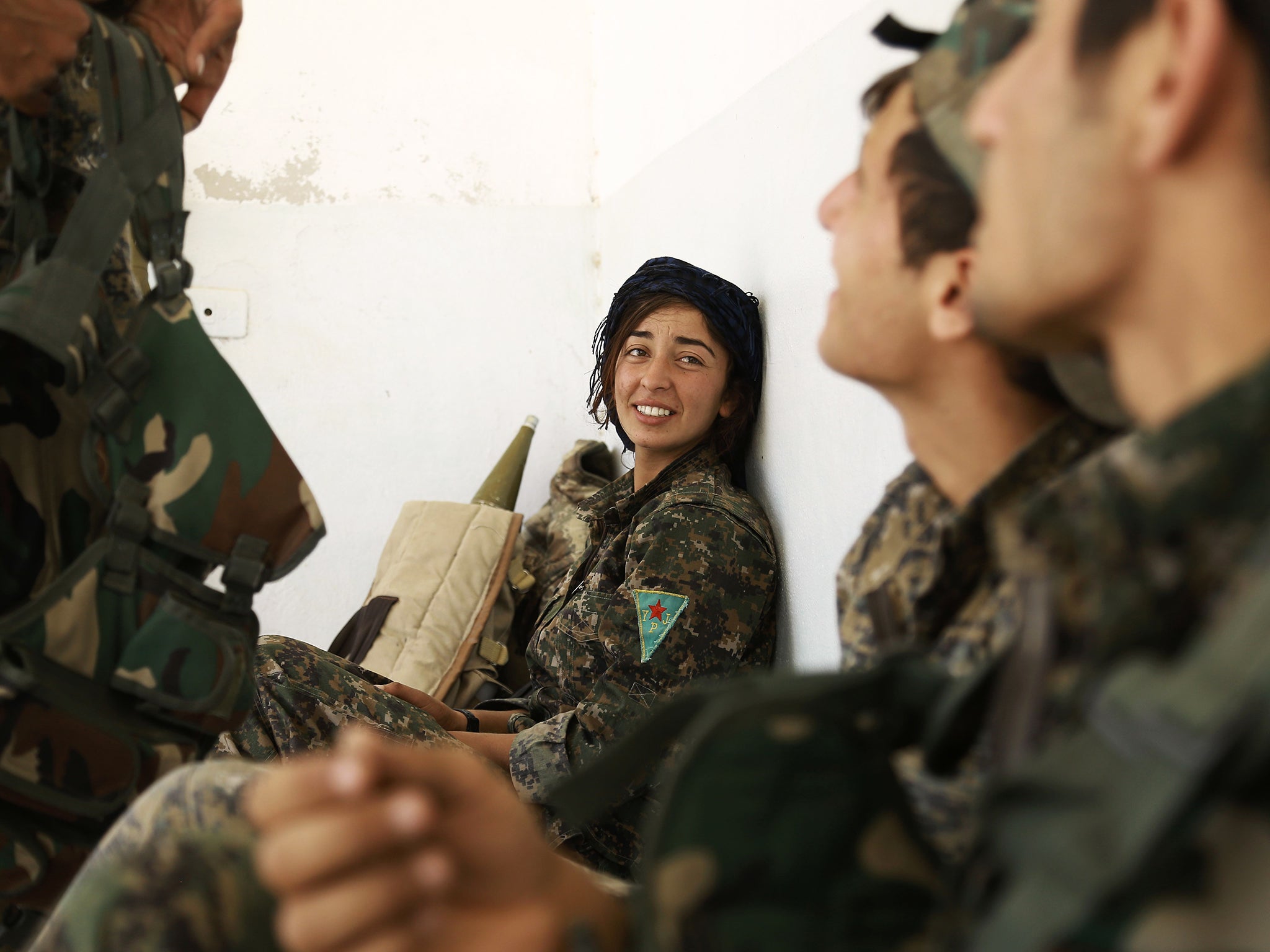 Fighters from the Kurdish People's Protection Units (YPG), part of the Syrian Democratic Forces (SDF), are seen in the village of Fatisah in the northern Syrian province of Raqqa