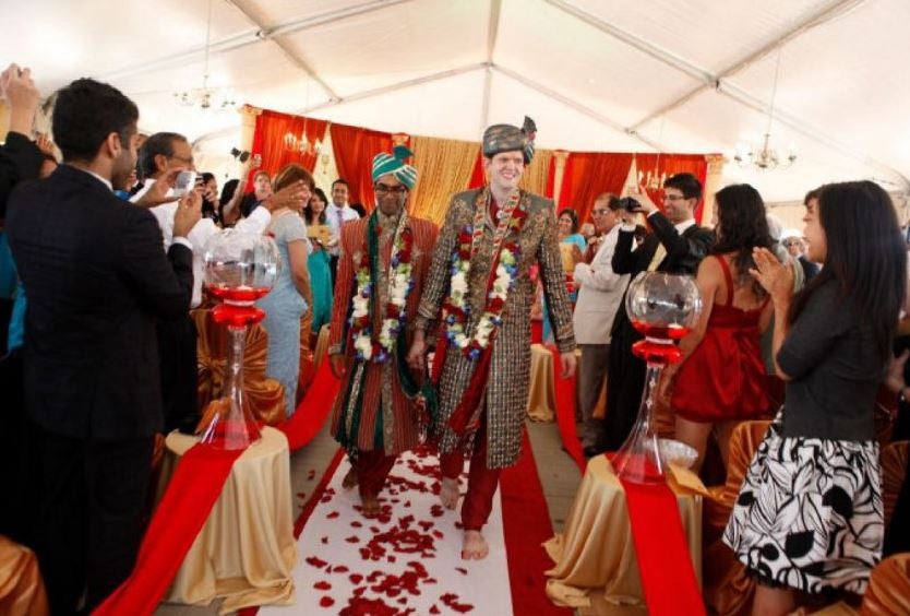 Rishi and Dan exchanged traditional flower garlands and were painted with henna