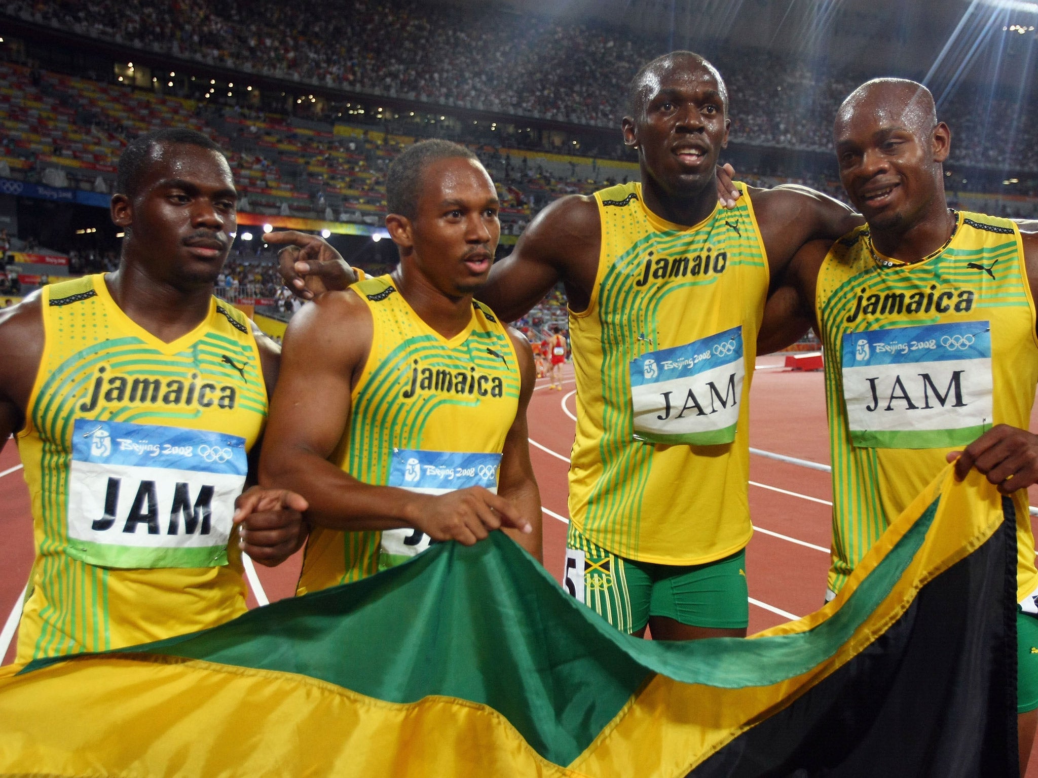 (L-R) Nesta Carter, Michael Frater, Usain Bolt and Asafa Powell celebrate Jamaica's 4x100m relay victory in 2008