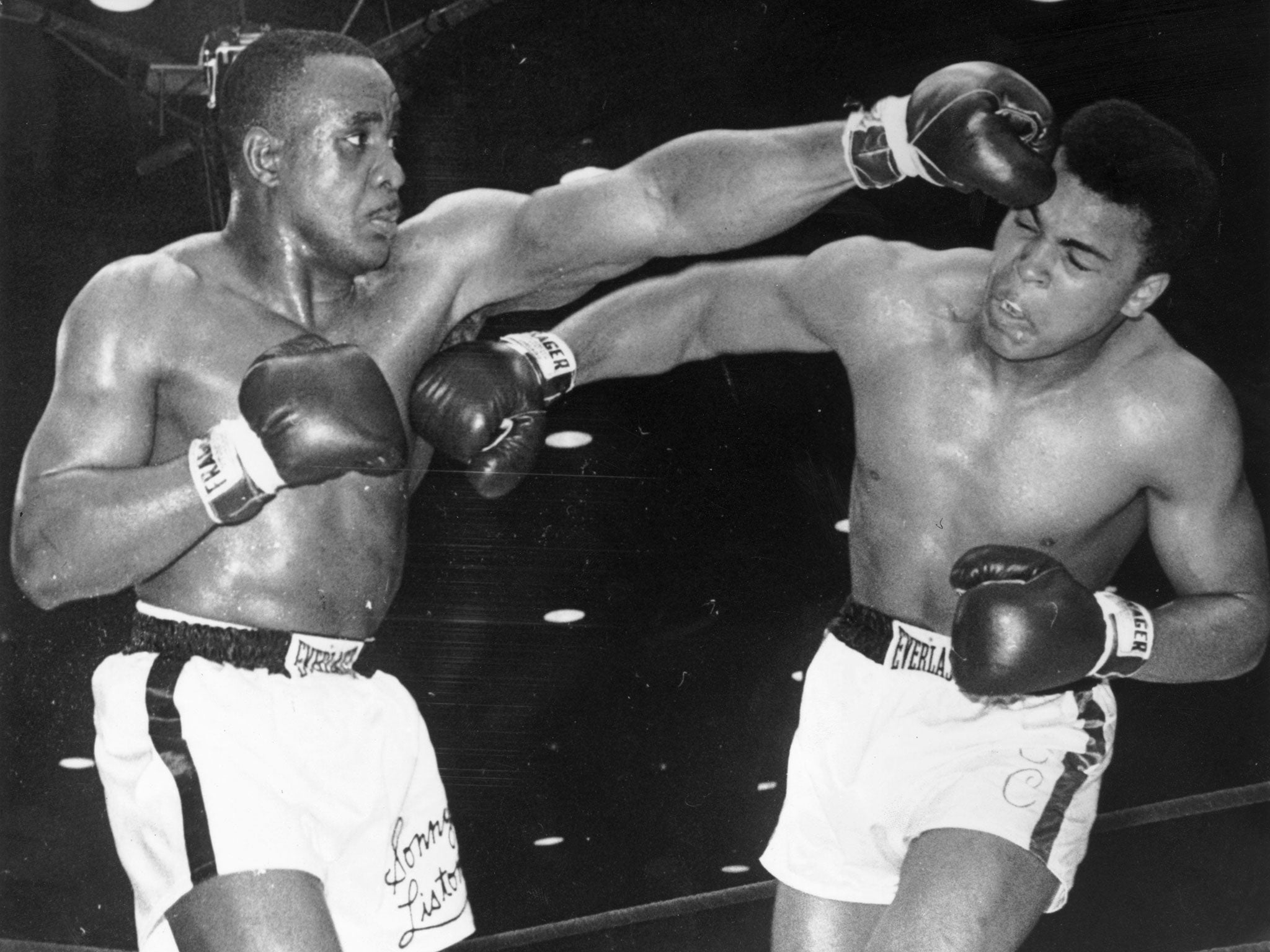 Muhammad Ali, landing a right to Sonny Liston's body during the World Heavyweight Championship fight at Miami Beach Convention Hall, USA, on 25th February 1964