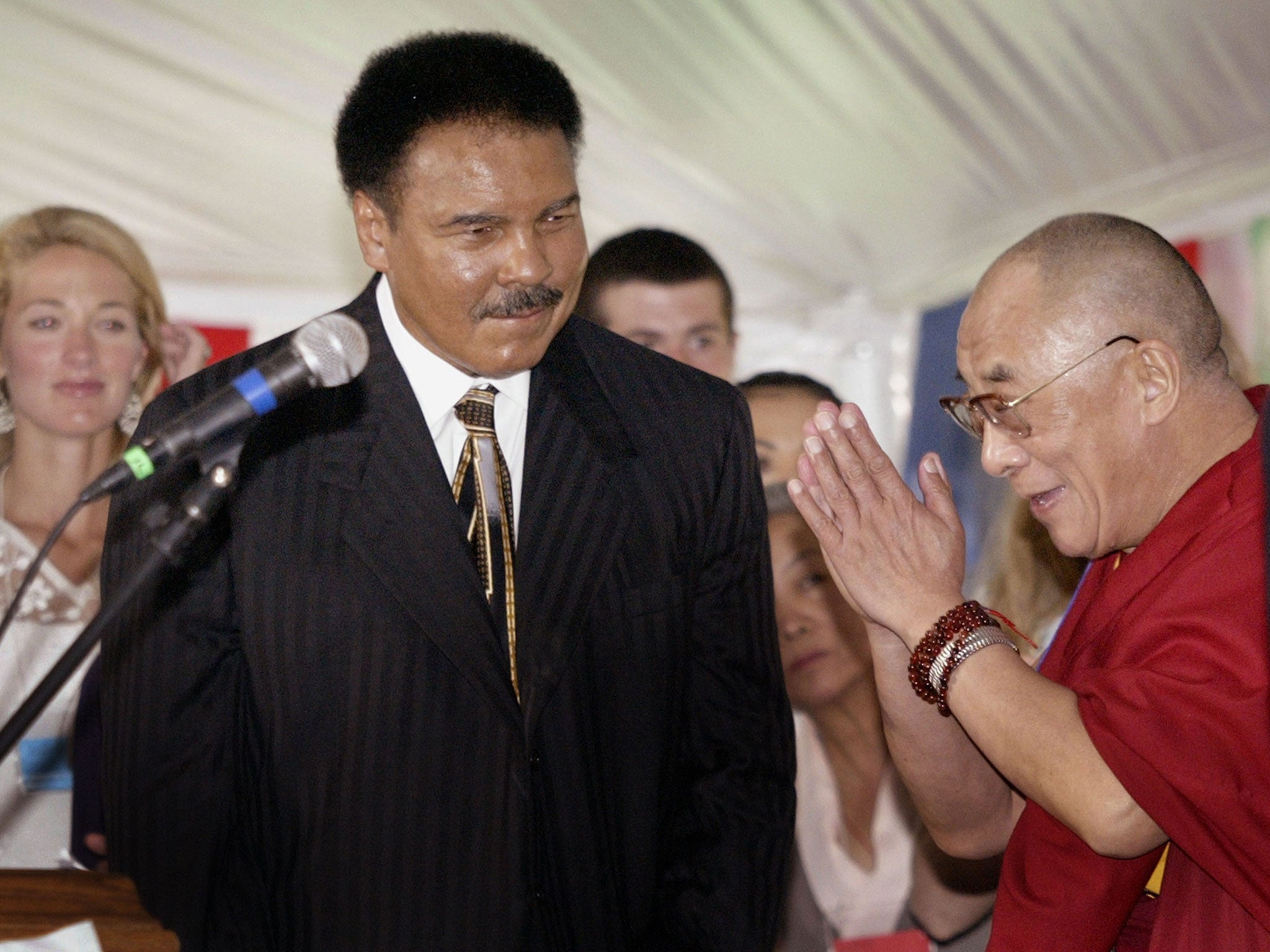 The Dalai Lama greets Muhammad Ali during a dedication ceremony for the Chamtse Temple in 2003 in Bloominton, Indiana