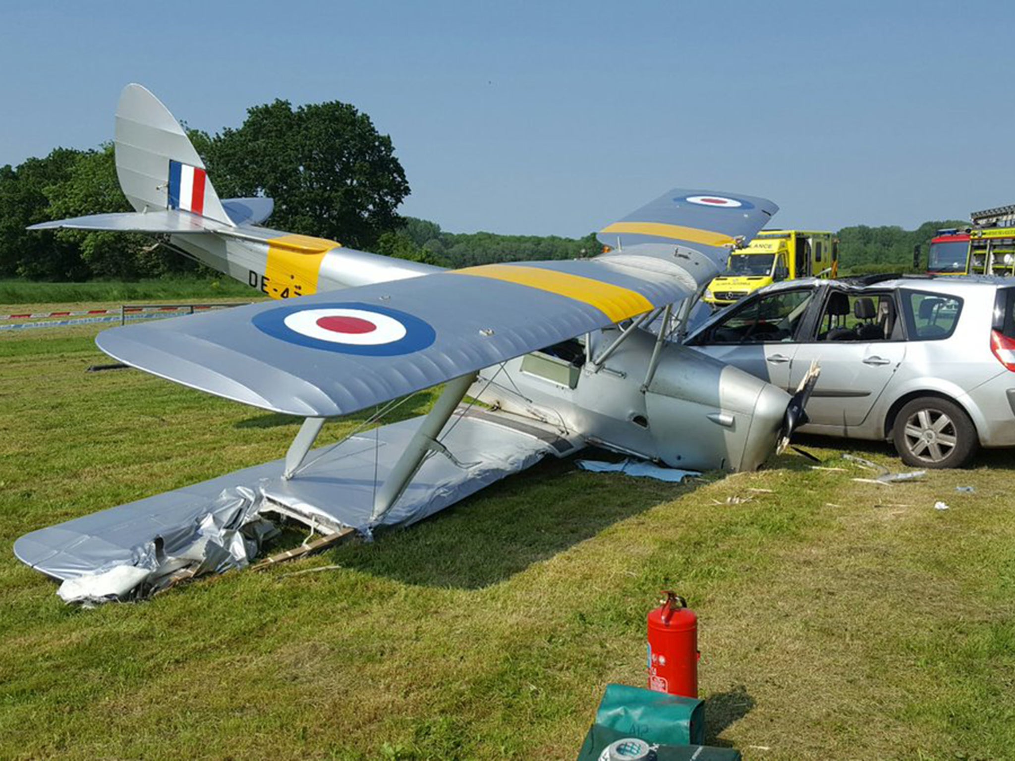 A Tiger Moth biplane hit a car after it crashed shortly after take-off yesterday at Brimpton Airfield near Reading