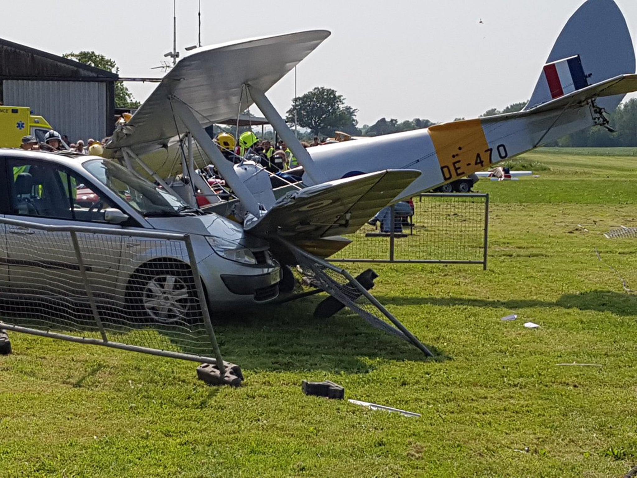 A Tiger Moth biplane hit a car after it crashed shortly after take-off yesterday at Brimpton Airfield near Reading