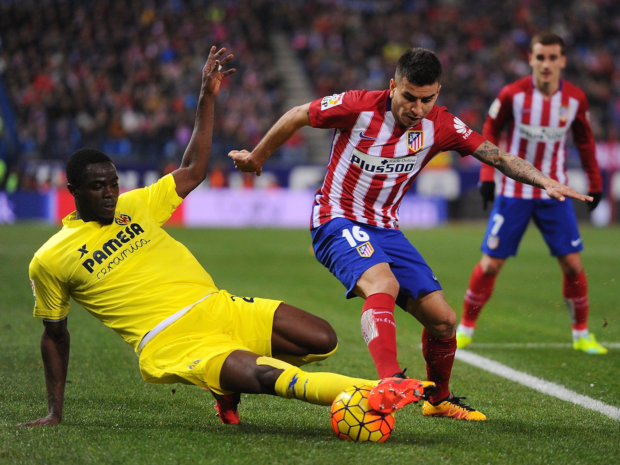 Bailly, left, challenging Atletico Madrid's Angel Correa