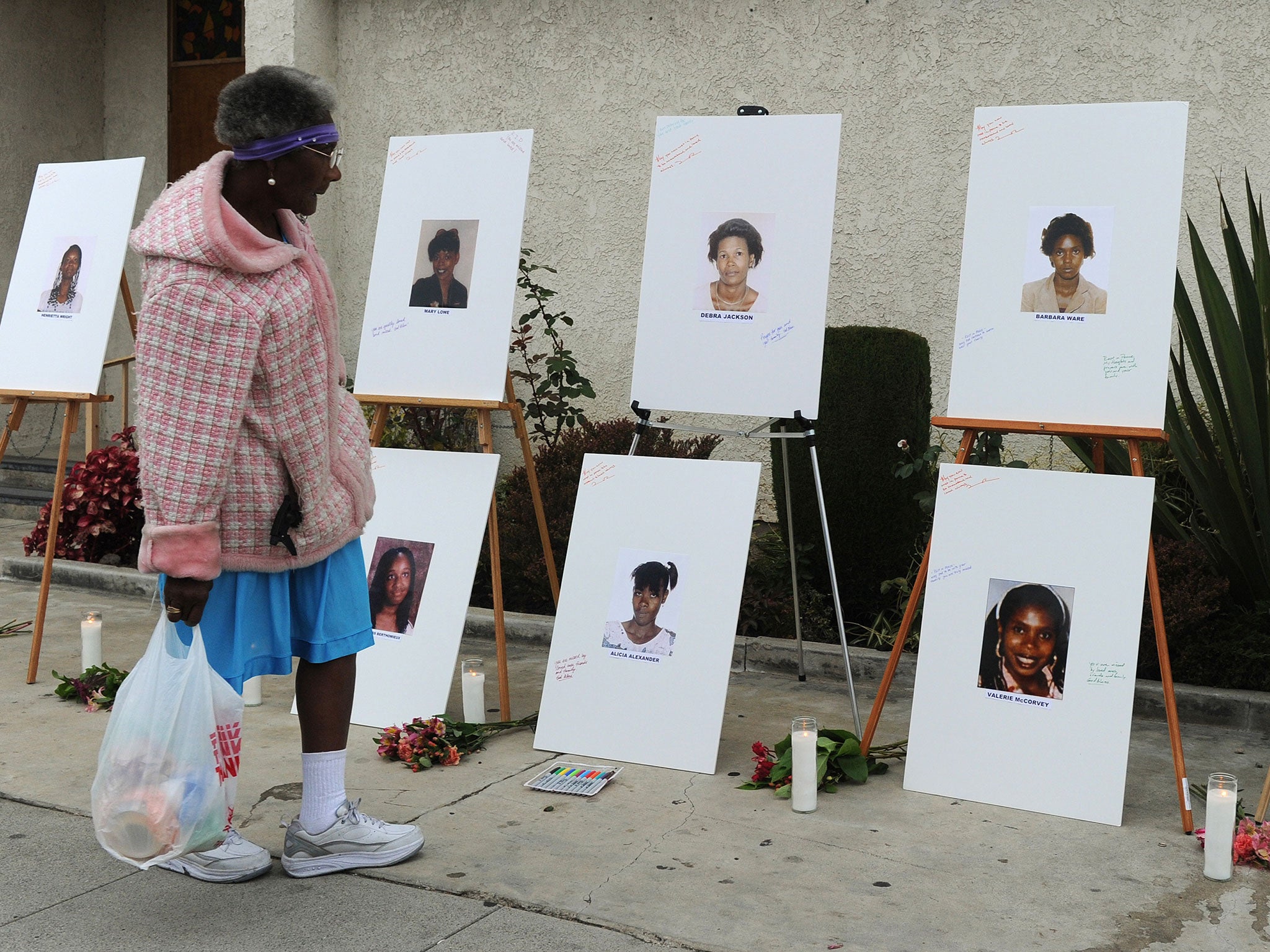 Photographs set up as a memorial for 10 of the victims of the serial killer