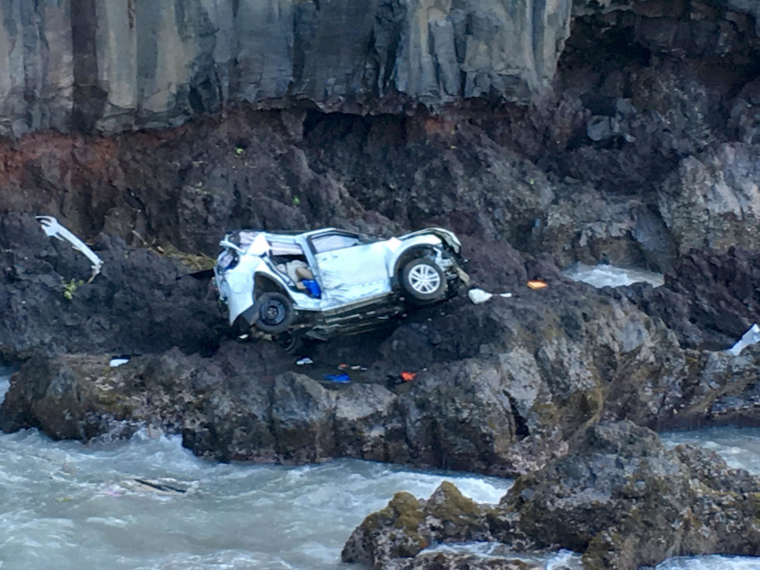 A Maui woman who was driving the vehicle when it plunged off the cliff is charged with murder in the death of her twin, who was in the passenger's seat