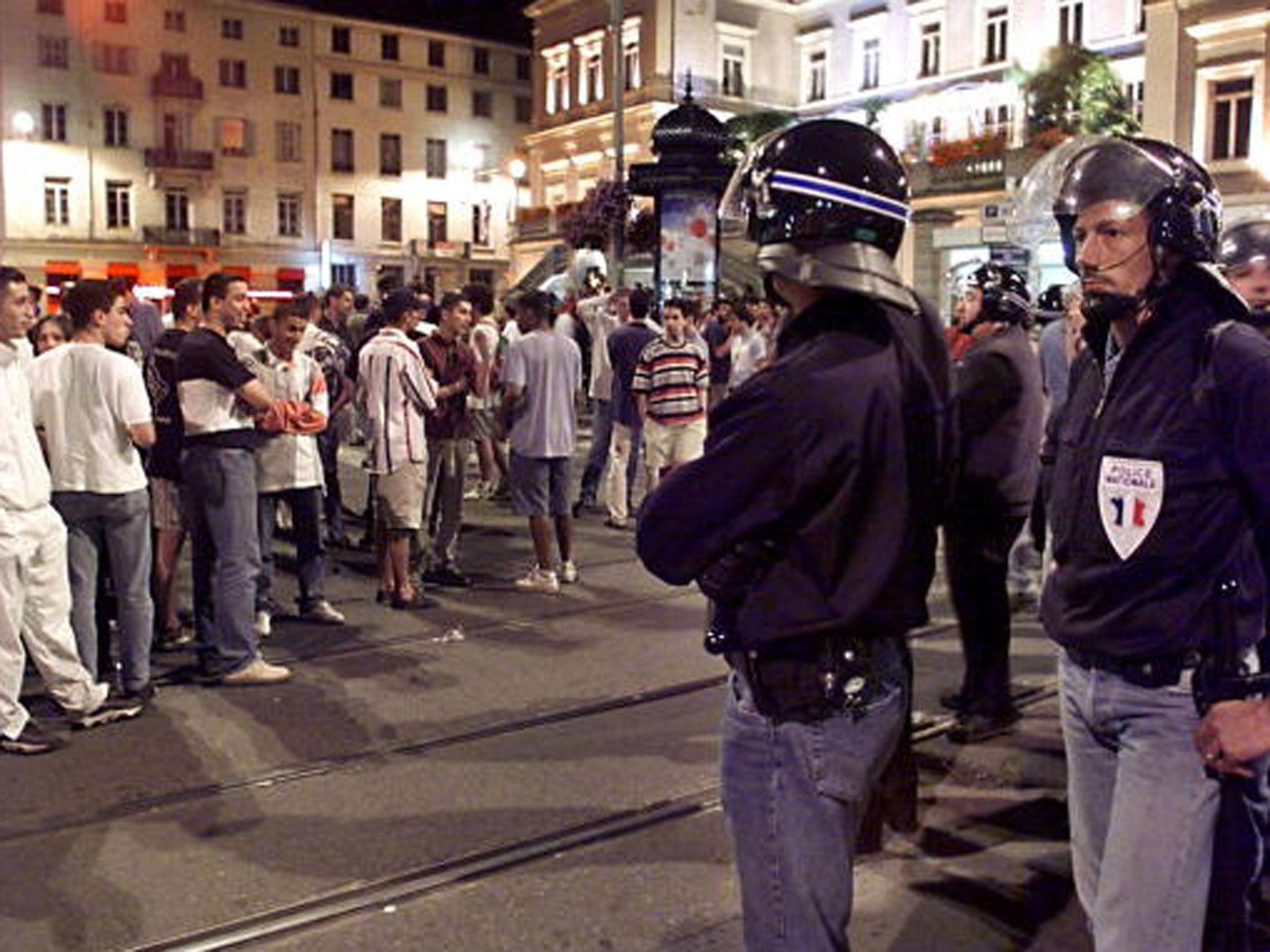 French police seperate local youths from England supporters in St Etienne during the 1998 World Cup finals in France. Warnings have been given ahead of England's opening Euro 2016 game, against Russia on Saturday (Getty)