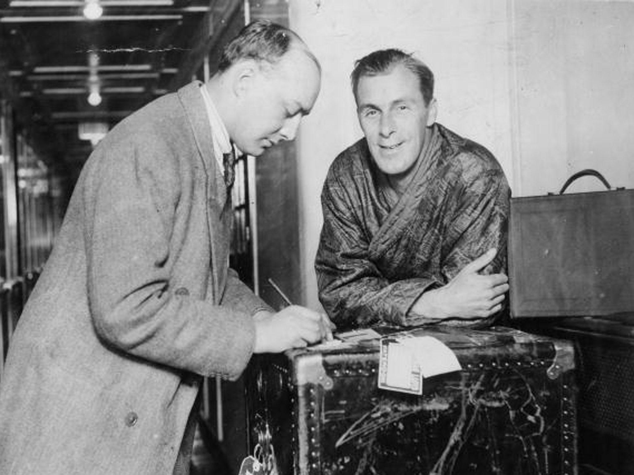 Bill Tilden is interviewed on board the Columbus on arrival in Plymouth at the height of his fame (Getty)