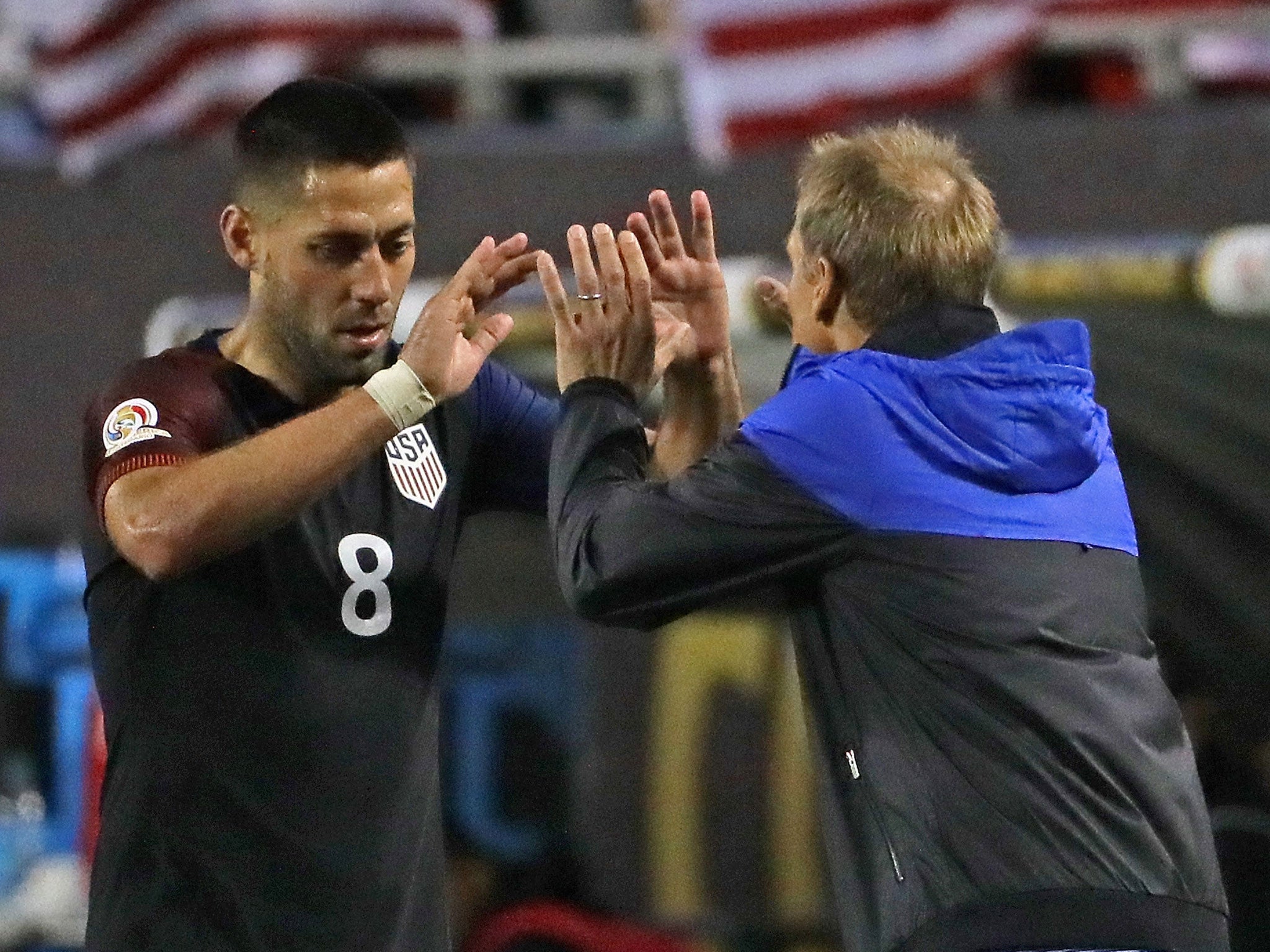 Clint Dempsey celebrates with Jurgen Klinsmann