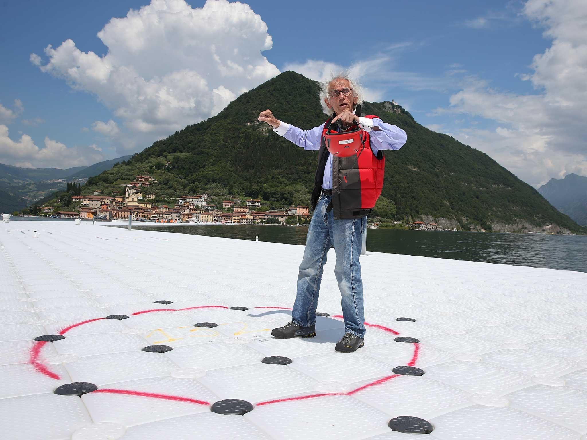 Christo tries out his floating cubes installation in northern Italy