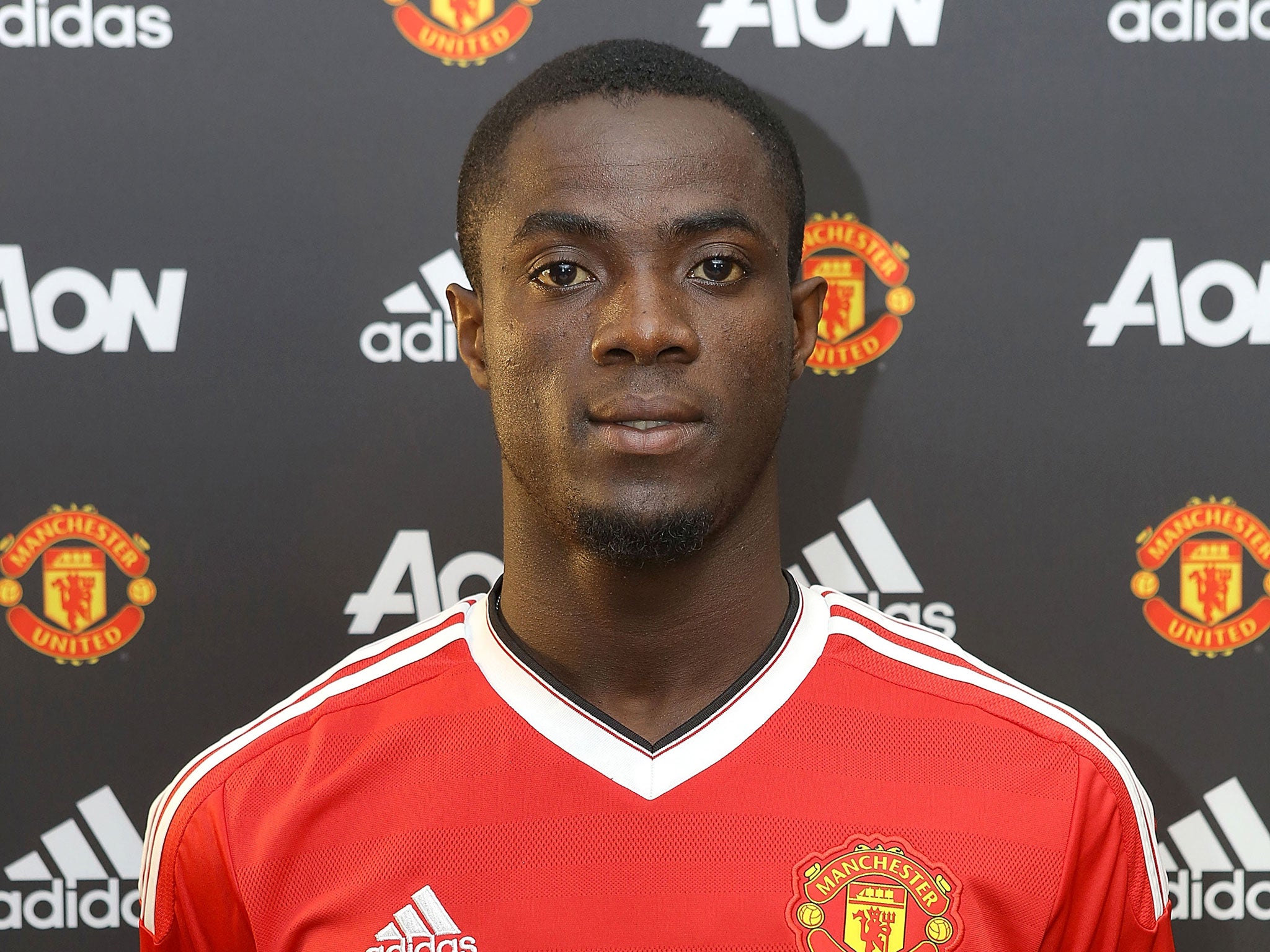 Eric Bailly poses following his £30m transfer to Manchester United