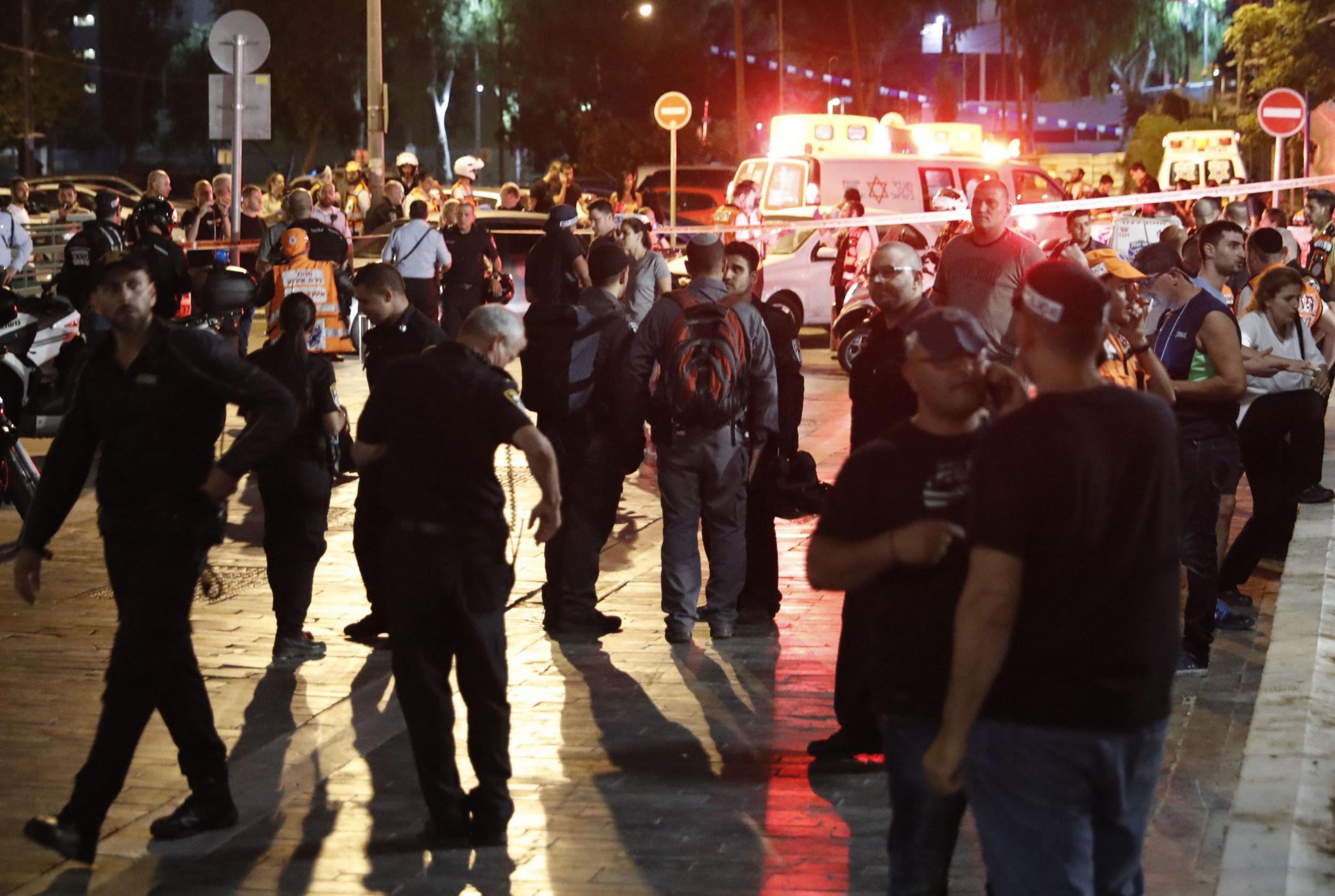 Emergency personnel and civilians at the scene the shooting. Jack Guez/AFP/Getty