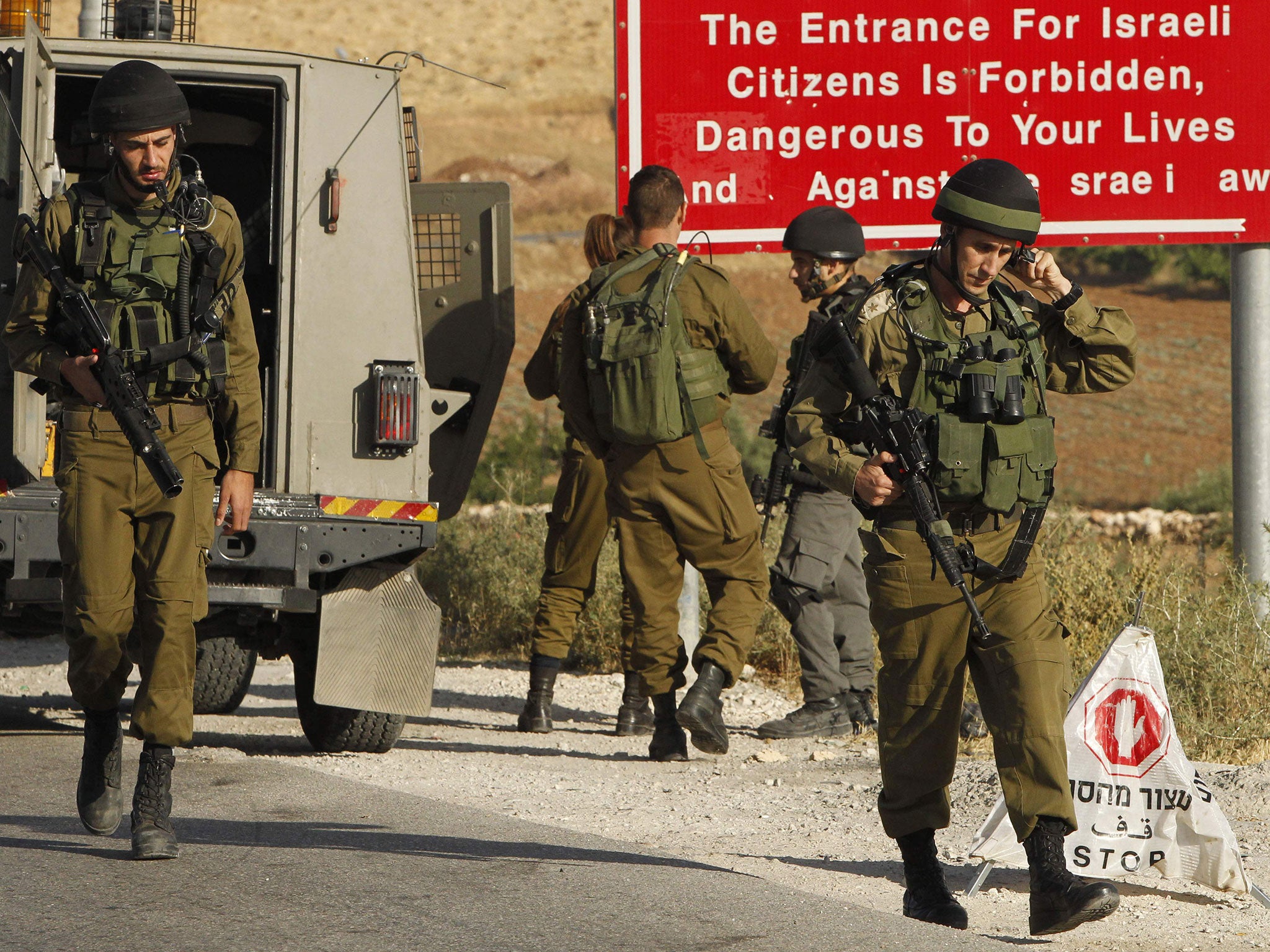Israeli soldiers at one of the entrances of the Palestinian village of Yatta in the West Bank on June 9 2016