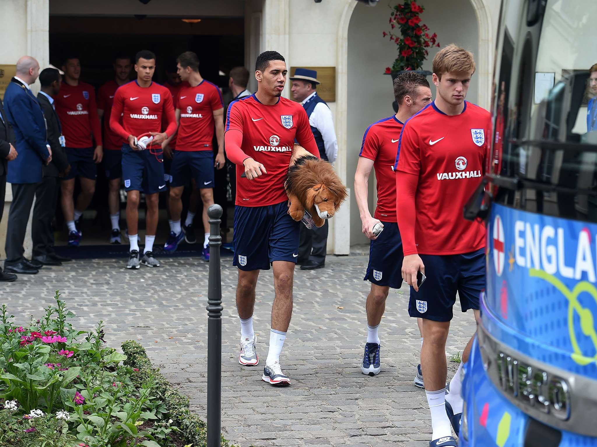 The England team leave their hotel in Chantilly - a considerably more peaceful setting than the one that awaits them