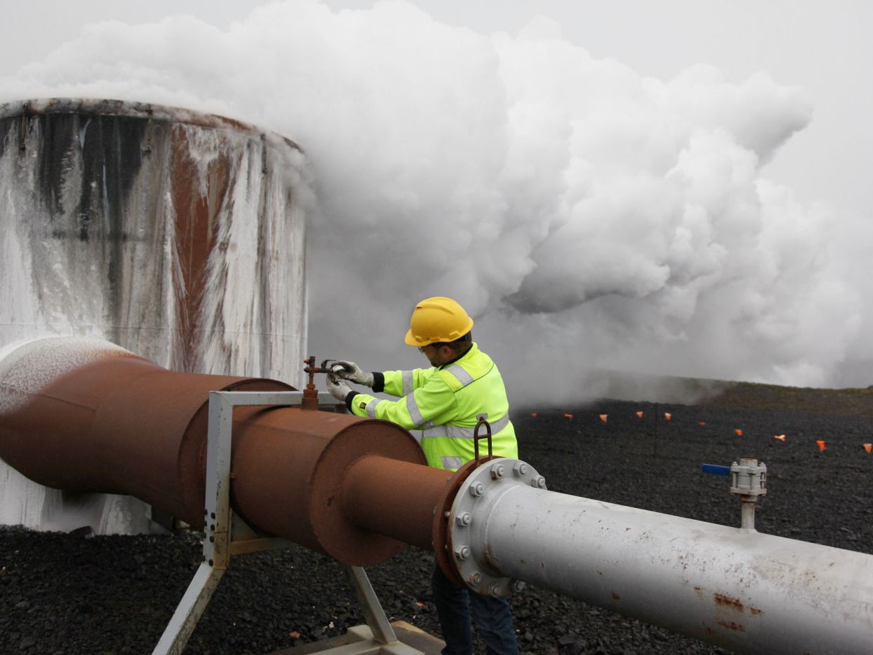 A CarbFix experiment's technical manager, checks a valve at a test well at Reykjavik Energy's Hellisheidi geothermal power plant in Iceland