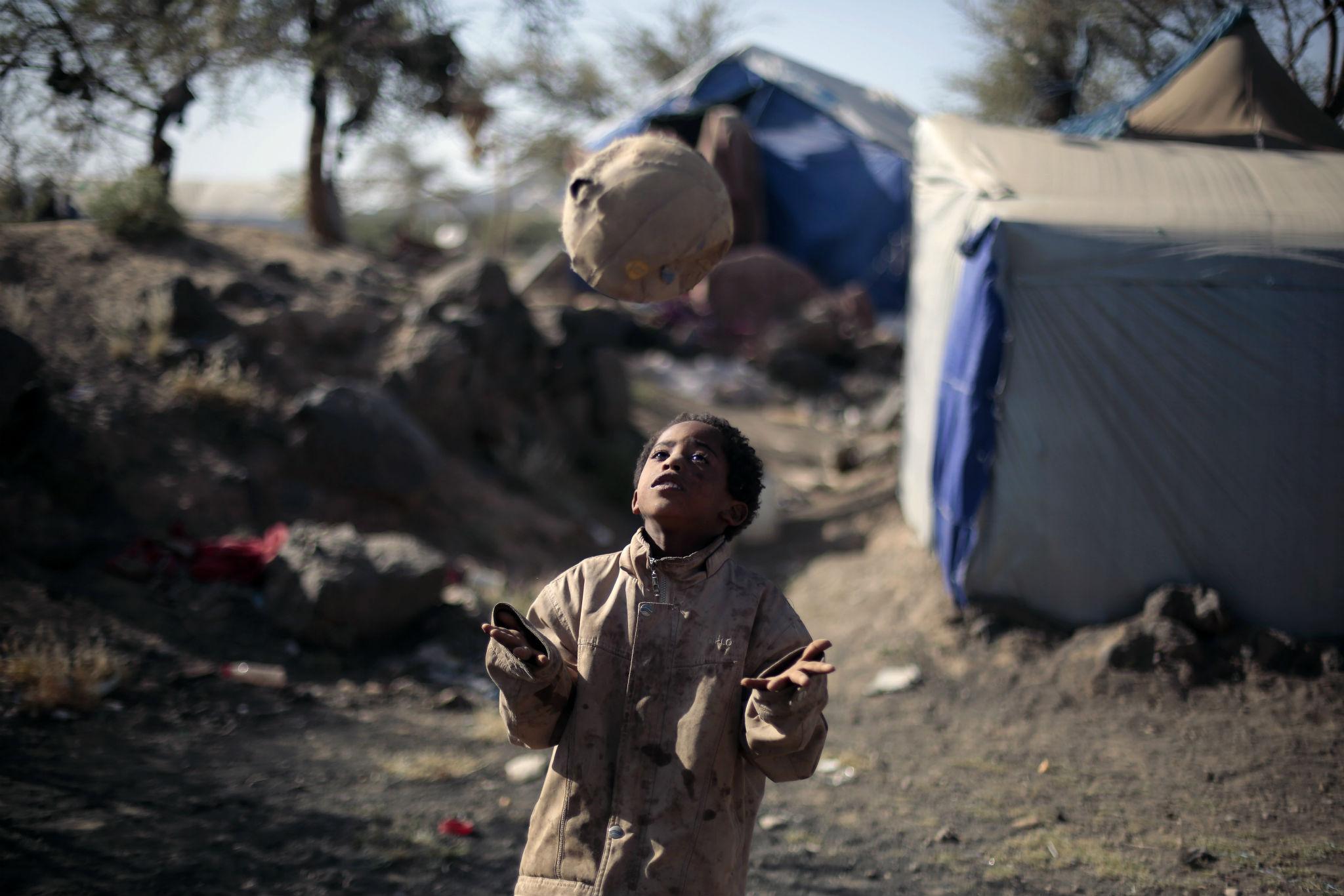 A displaced boy plays at a camp near Sanaa. More than 500 children have been killed during the conflict in Yemen since March 2015 (AP)