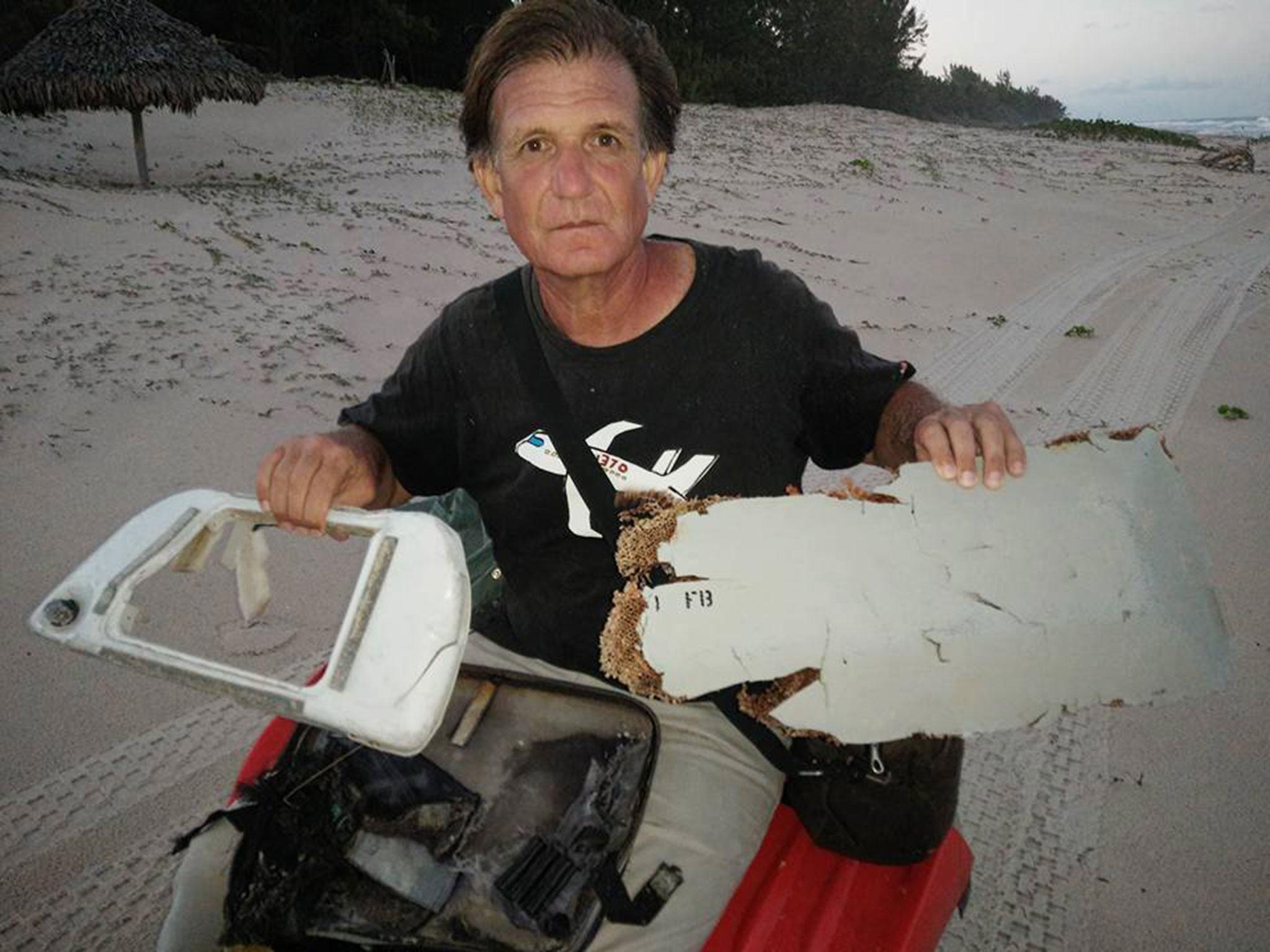 Blaine Gibson with suspected MH370 debris that he found on a beach in Madagascar