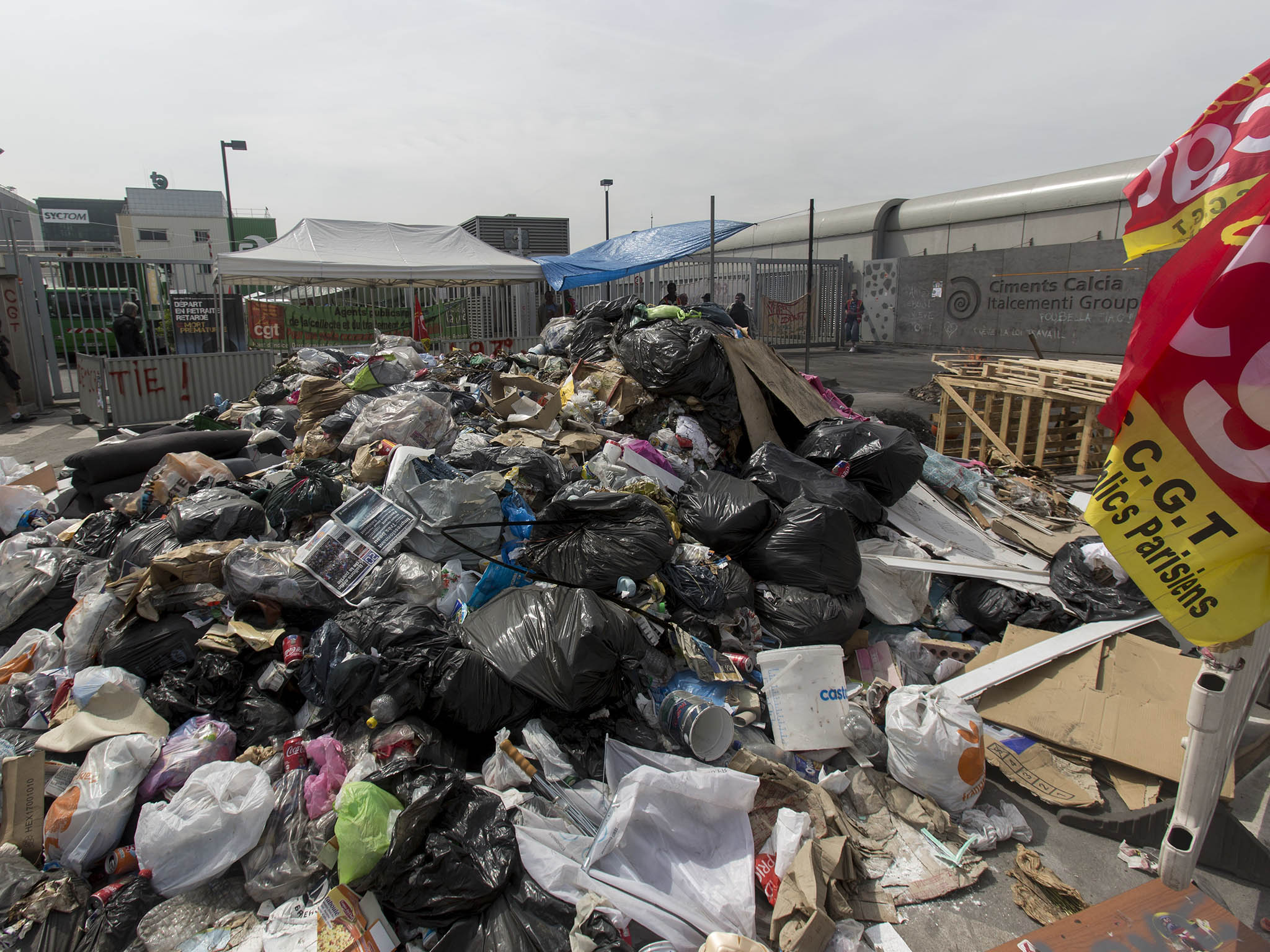 Garbage is piled up, as French striking CGT labour Union garbage collectors block access to the Paris waste treatment center in Ivry Sur Seine, near Paris