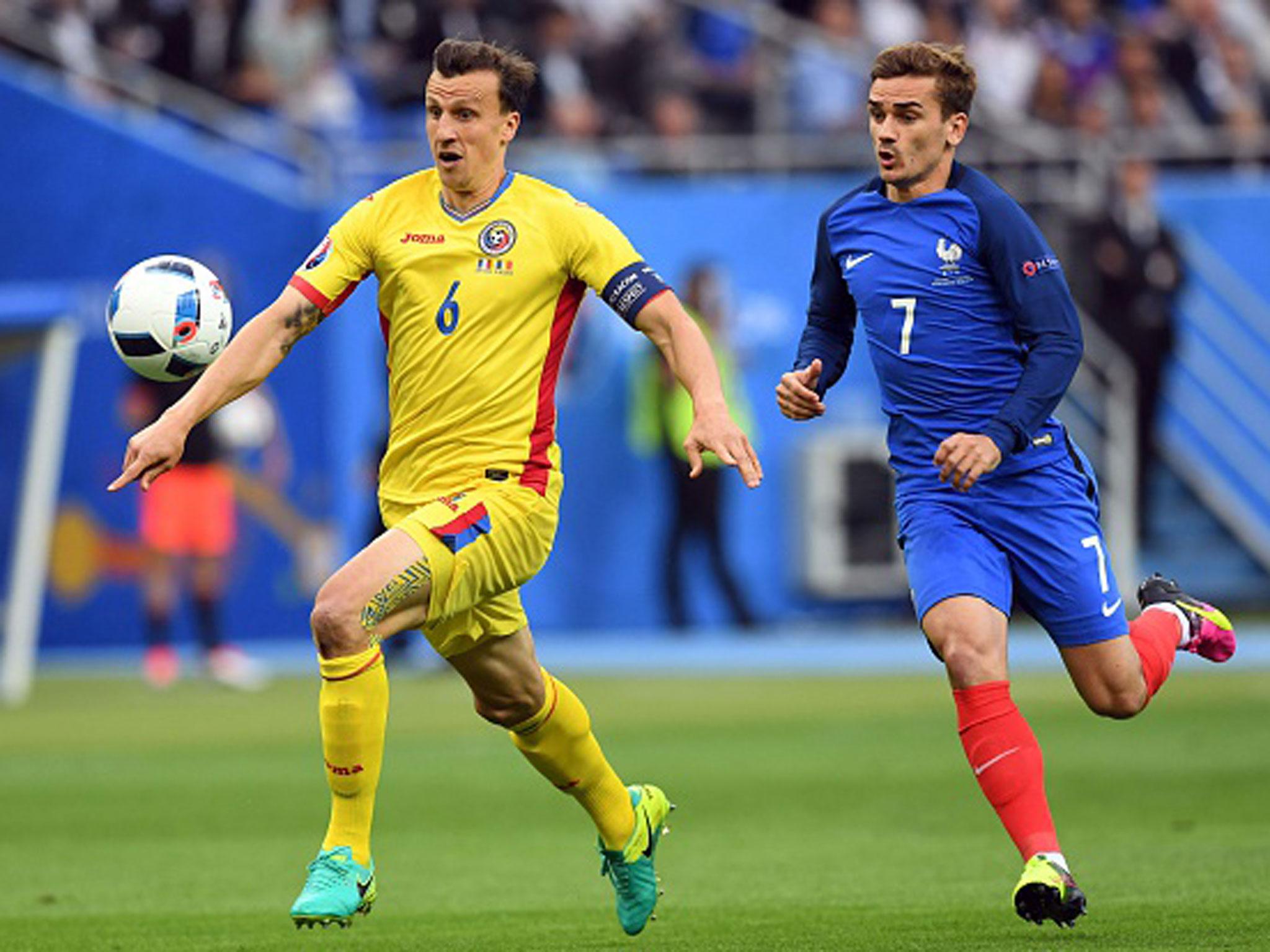 Vlad Chiriches and Antoine Griezmann in action during France's 2-1 win over Romania on Friday night (Getty)