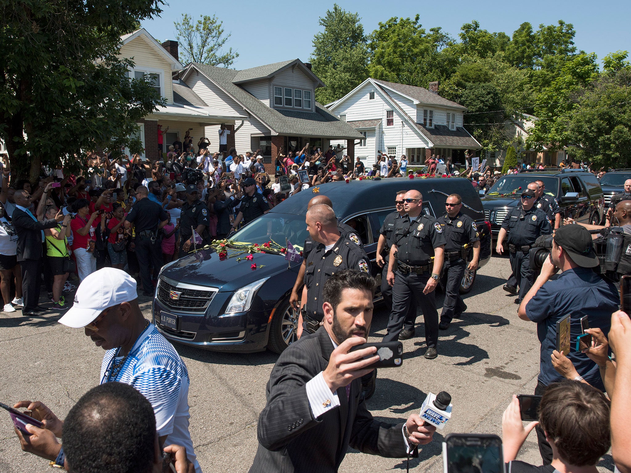 The funeral procession for Muhammad Ali makes its way through Louisville