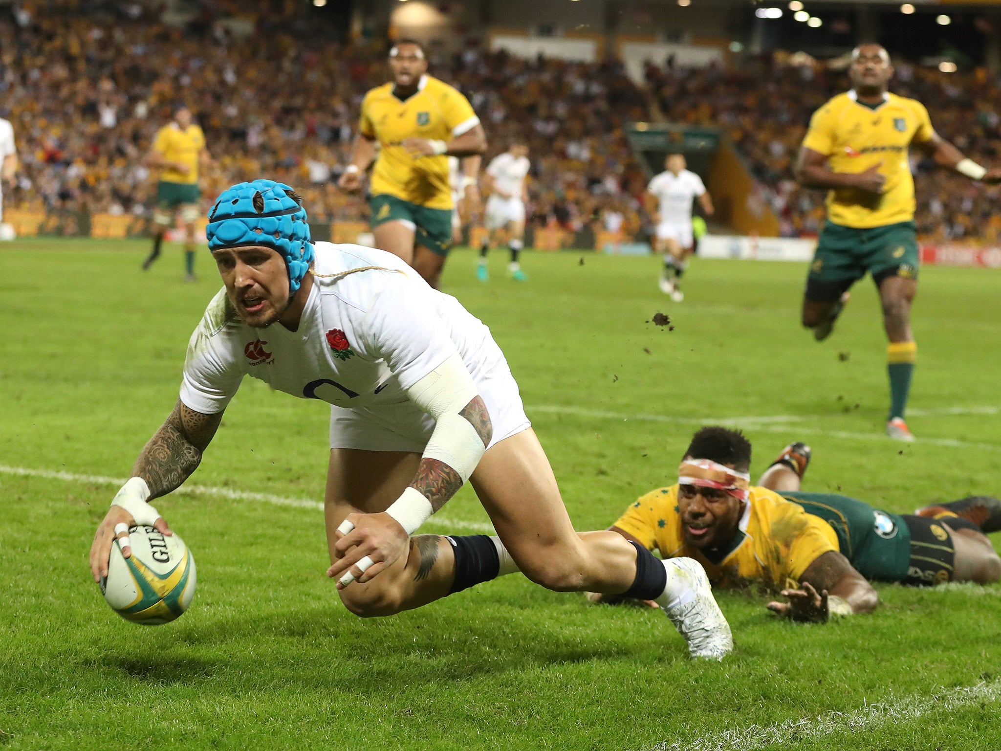 Jack Nowell dives over the line to score the third try for England