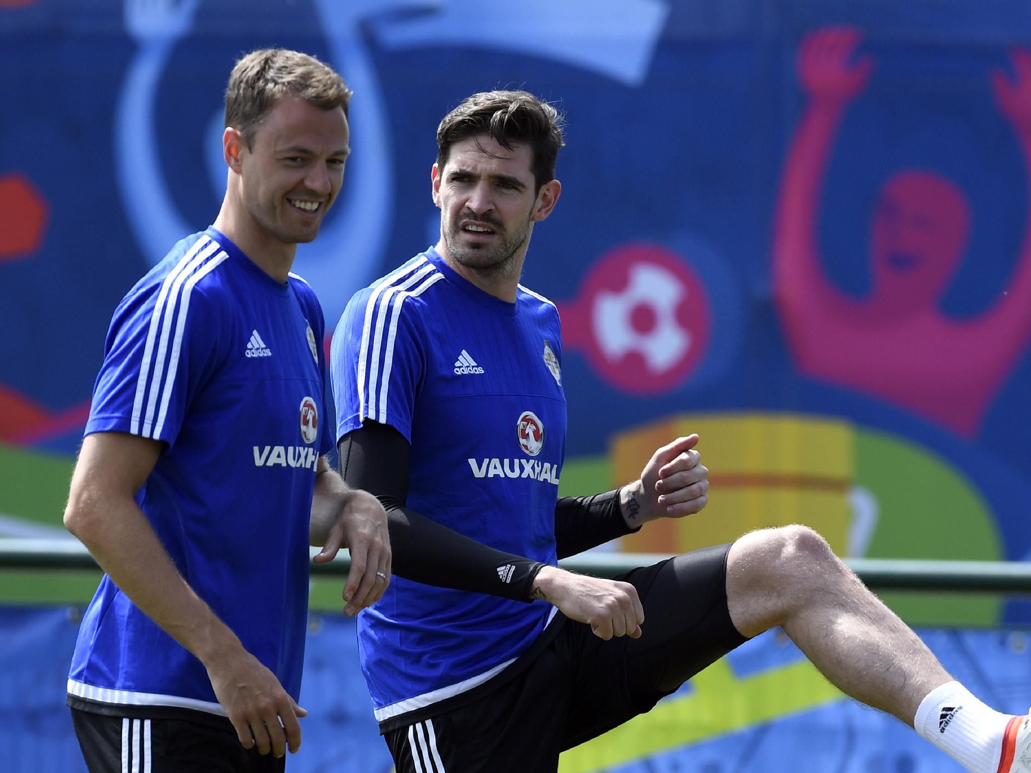 Jonny Evans, left, is one of the few Premier League players in Northern Ireland's squad