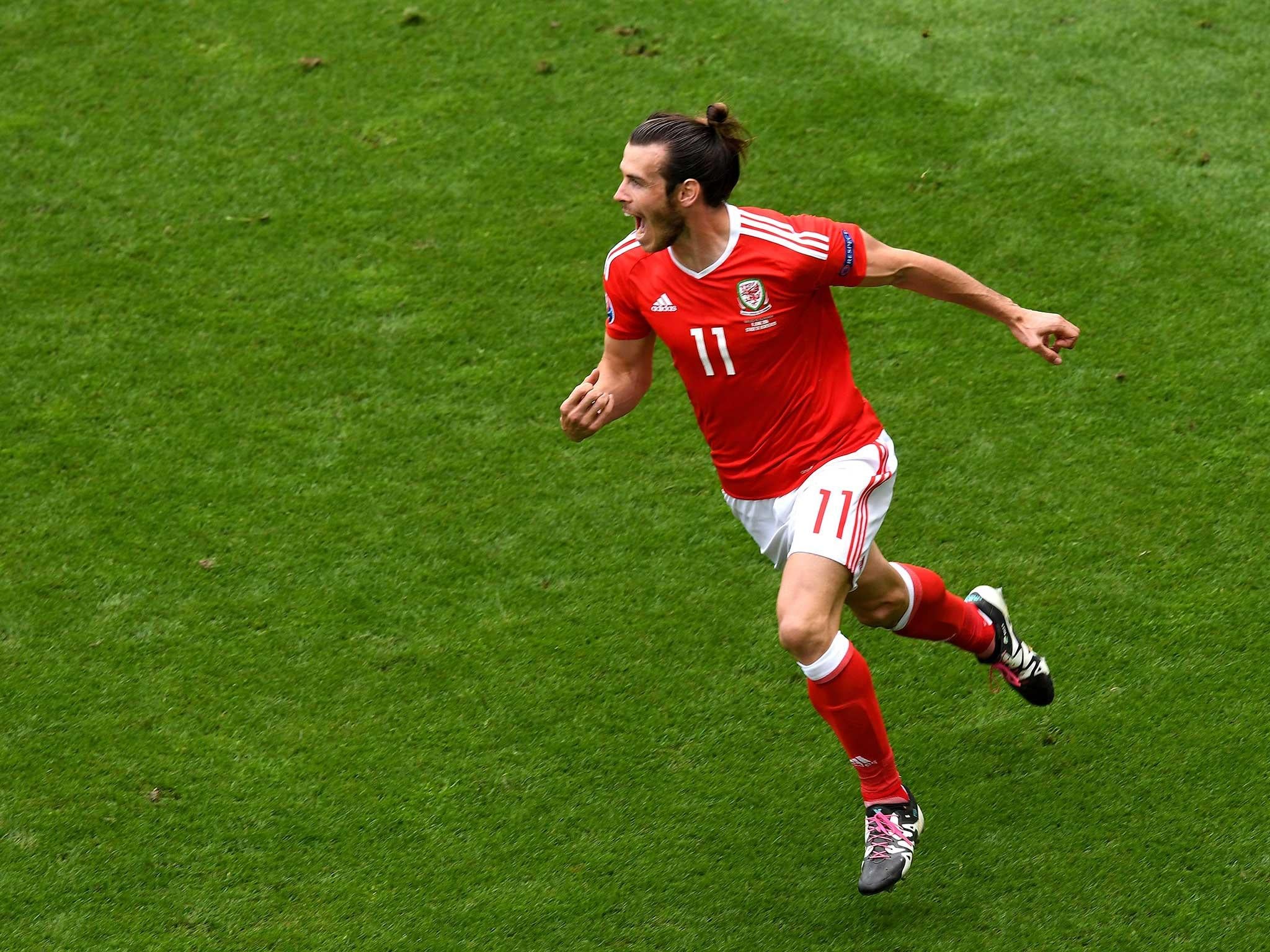 Gareth Bale wheels away in delight after scoring for Wales