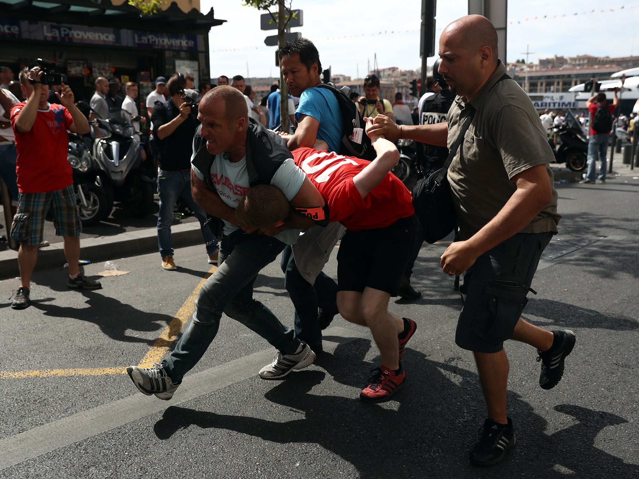 An England fan is arrested after clashing with police ahead of the game against Russia