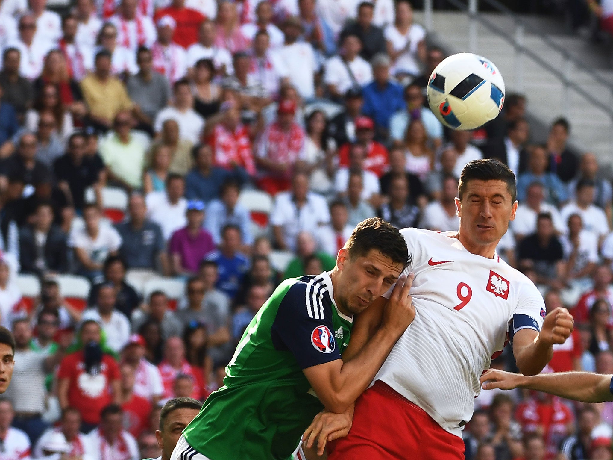 Robert Lewandowski and Craig Cathcart compete for the ball