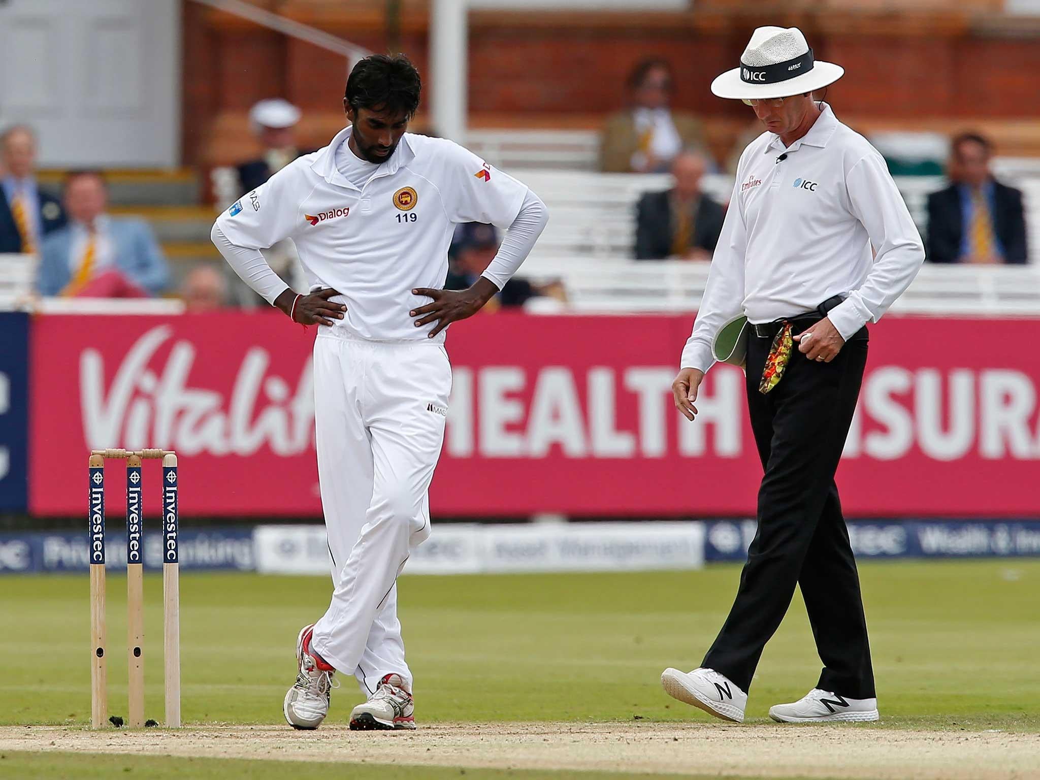 Nuwan Pradeep reacts after umpire Rod Tucker calls a no ball