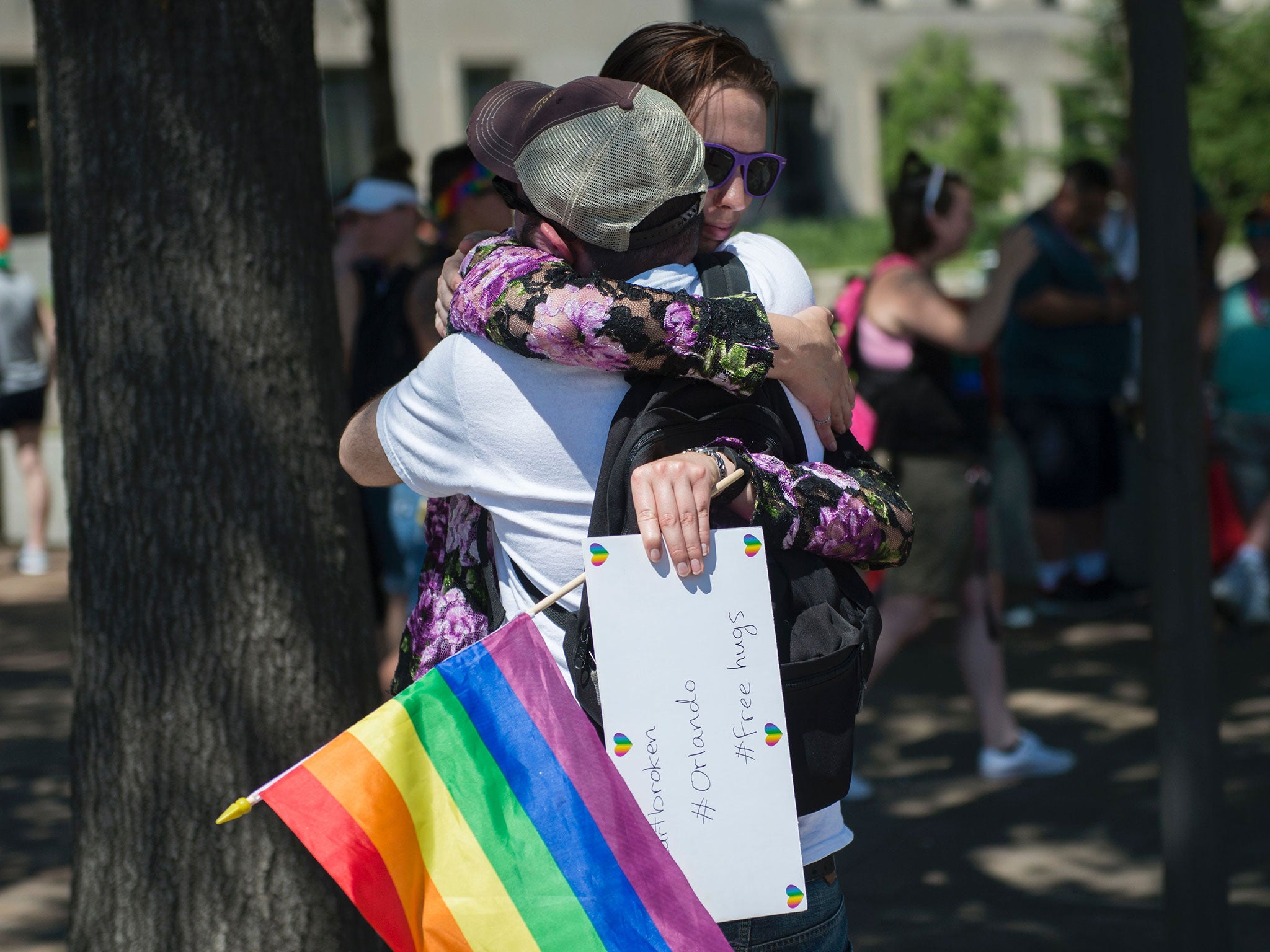 A woman offers free hugs in Washington in reaction to the mass shootings at Pulse