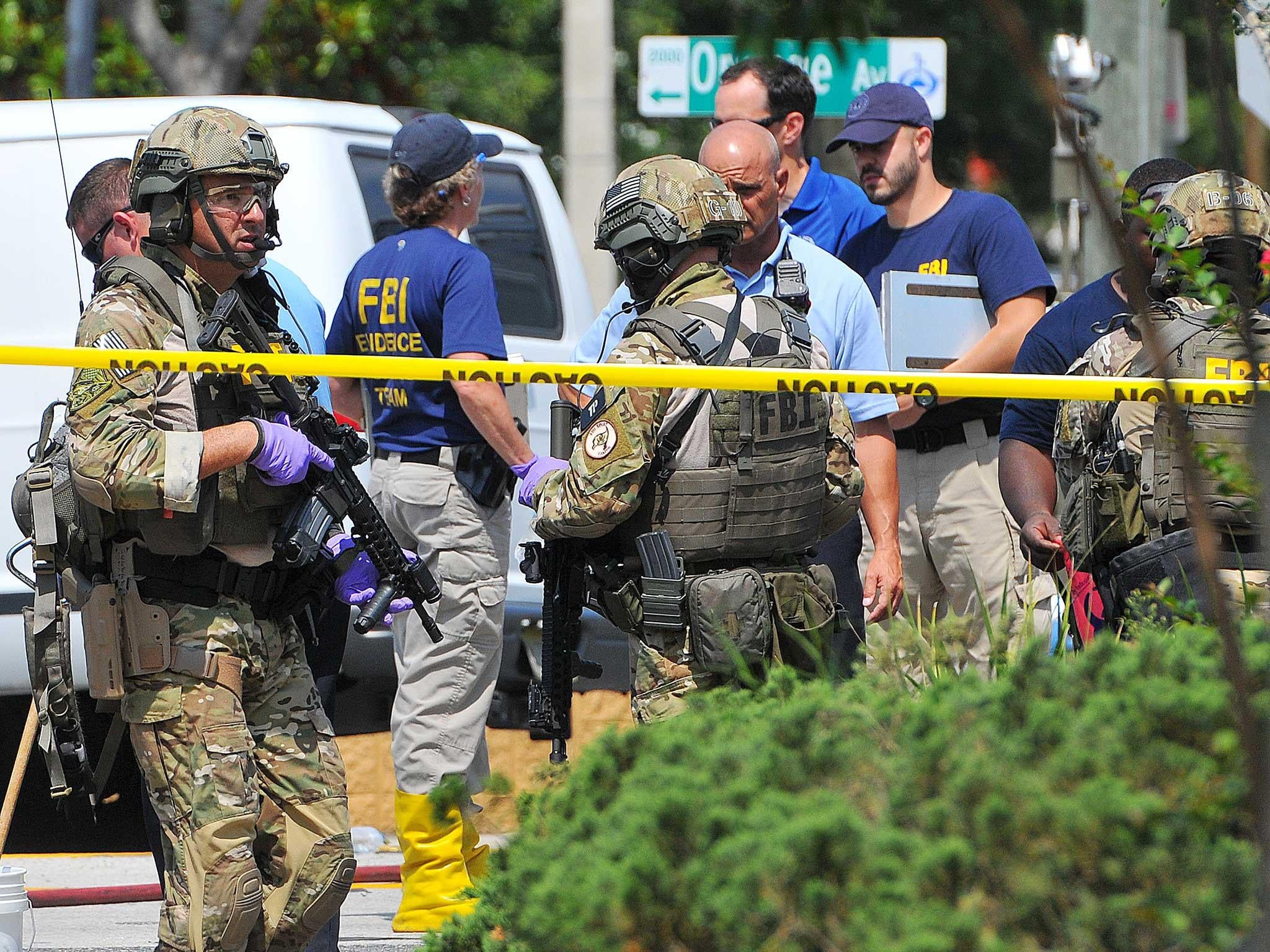 A gunman wielding an assault-type rifle and a handgun opened fire inside a crowded gay nightclub in Orlando